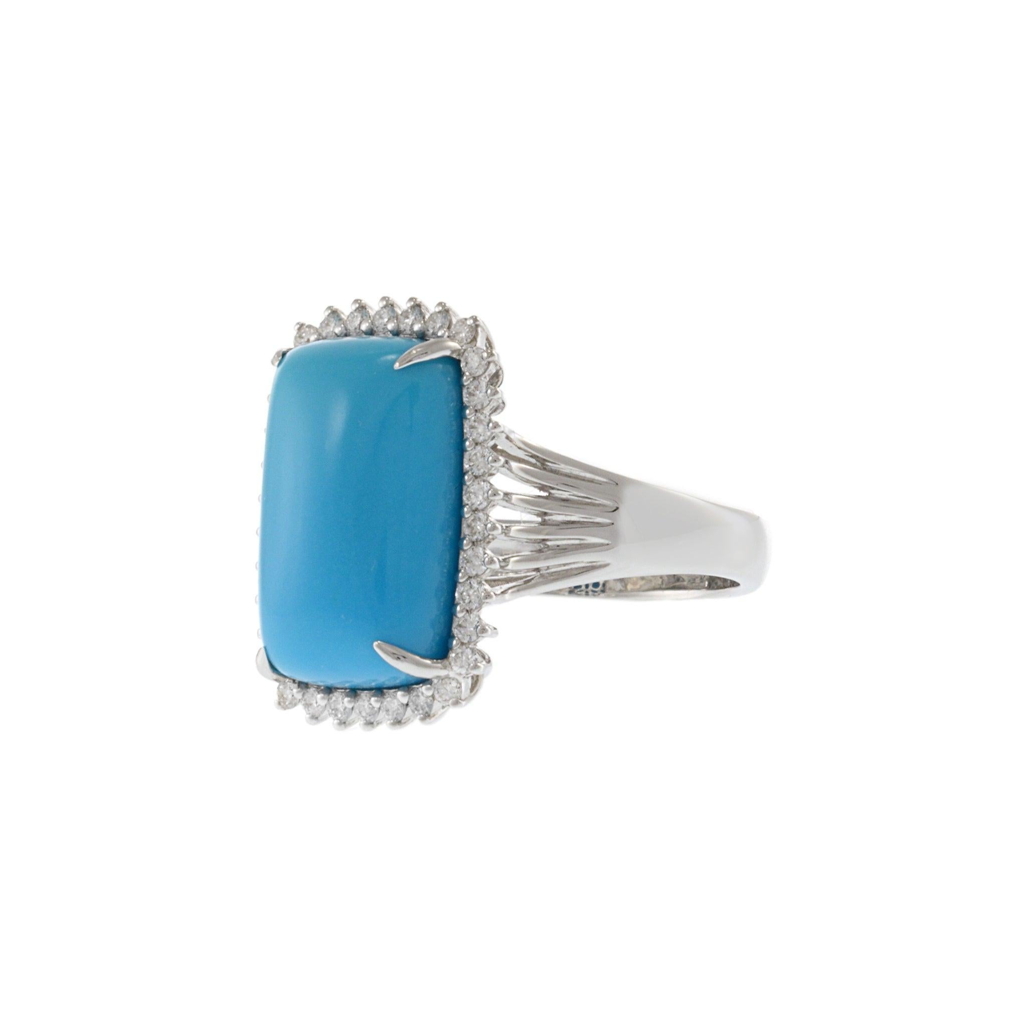 Striking in color and form, this cocktail ring showcases a vivid natural turquoise cabochon set in 18KT white gold. The rectangular turquoise center is framed by a halo of round brilliant diamonds, creating a radiant contrast between bold color and