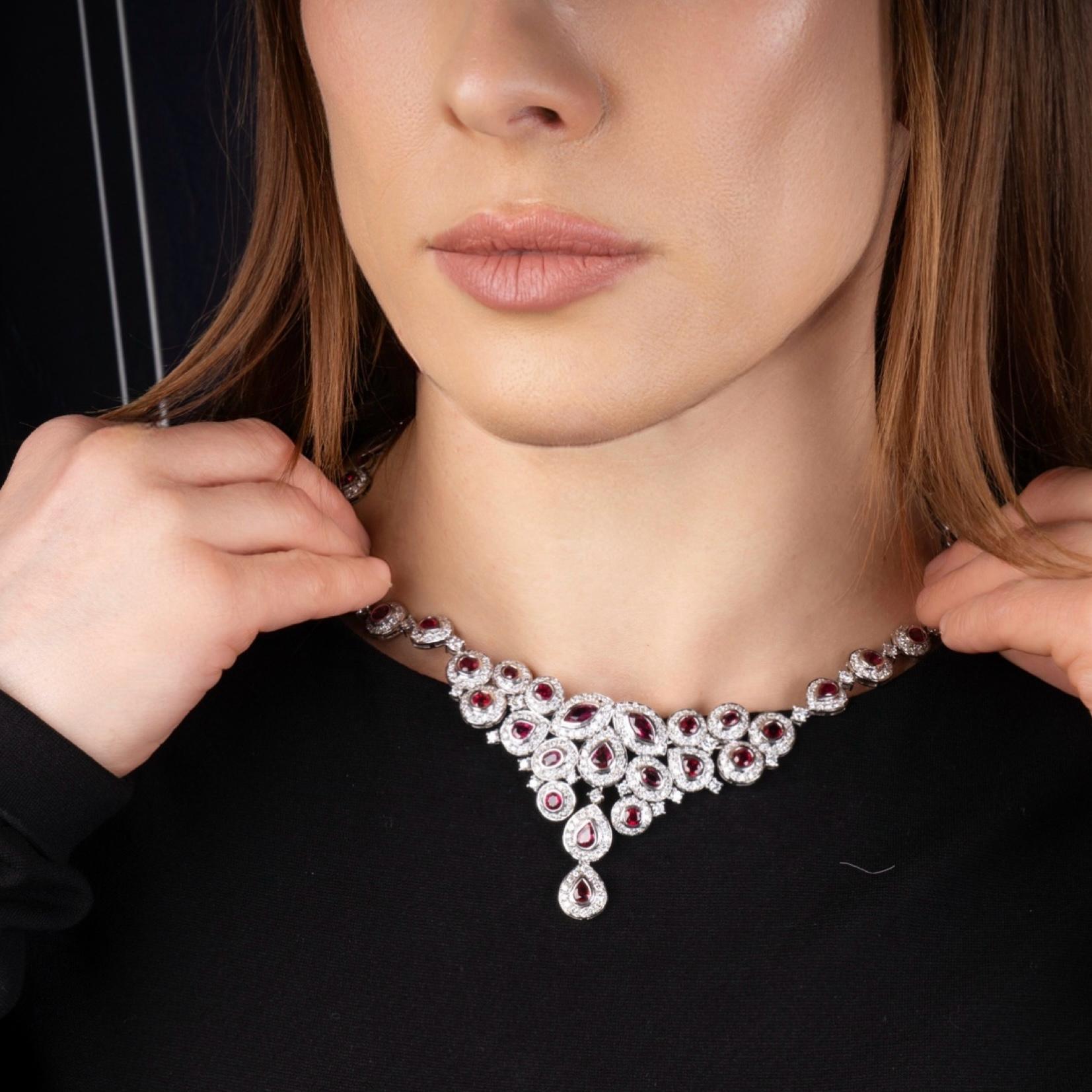 18kt White Gold Necklace Set with Diamonds and Rubies. 
Made in late 1990s.
Made in Italy. 
Hallmarked with 750 gold mark and Italian markings. 

A magnificent 18kt white gold necklace intricately set with 403 round brilliant-cut diamonds and 41