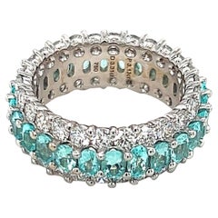 Or blanc 18 carats tourmaline bleue ovale 3,13 carats et diamants brillants 3,31 carats Bande