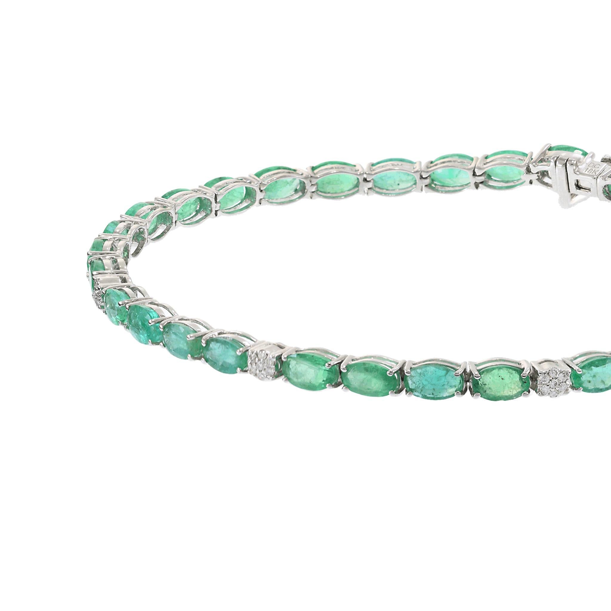 A stunning 18KT white gold tennis bracelet, featuring 6.83CT-TW of oval-cut emeralds, elegantly set in a timeless design. Accentuating the vibrant green gemstones are 0.07CT-TW of round-cut diamonds, adding a subtle brilliance to the piece. Weighing