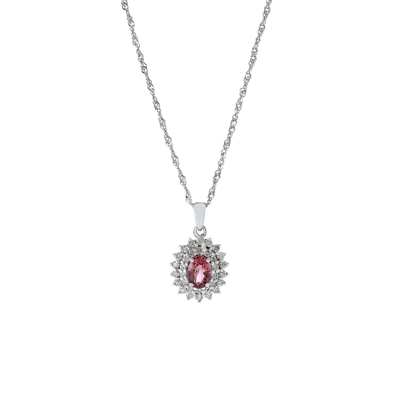 This 18KT white gold pendant necklace is a stunning and elegant piece of jewelry, featuring a genuine oval-cut pink sapphire with a total weight of 0.81 carats at its center. The pink sapphire is elegantly surrounded by round-cut diamonds with a