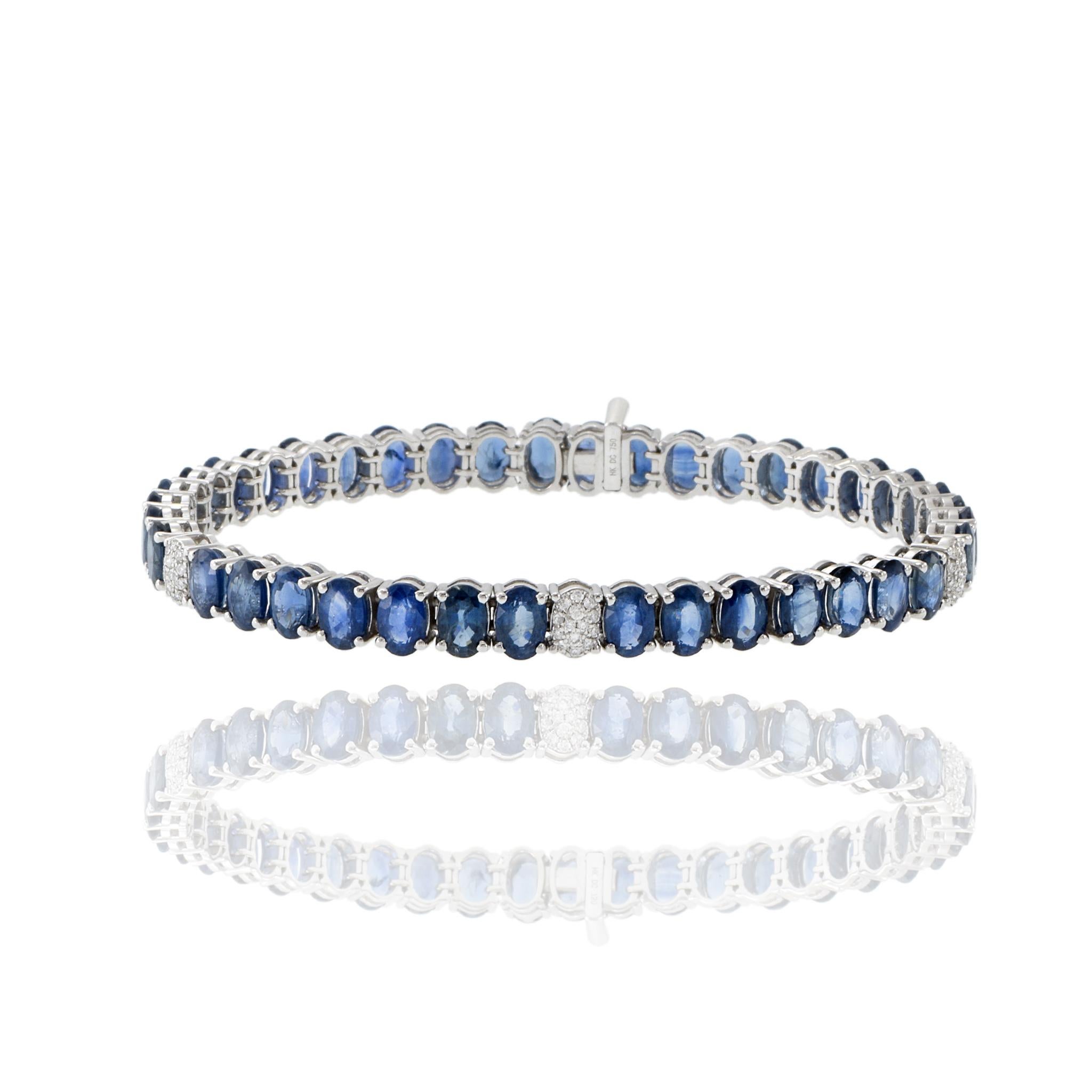 Experience incredible sparkle and elegance with this exquisite 18KT white gold bracelet featuring 24.29CT-tw of oval genuine blue sapphires. The vivid blue hues are complemented by 0.24CT-TW of round brilliant-cut diamonds, exhibiting a stunning G