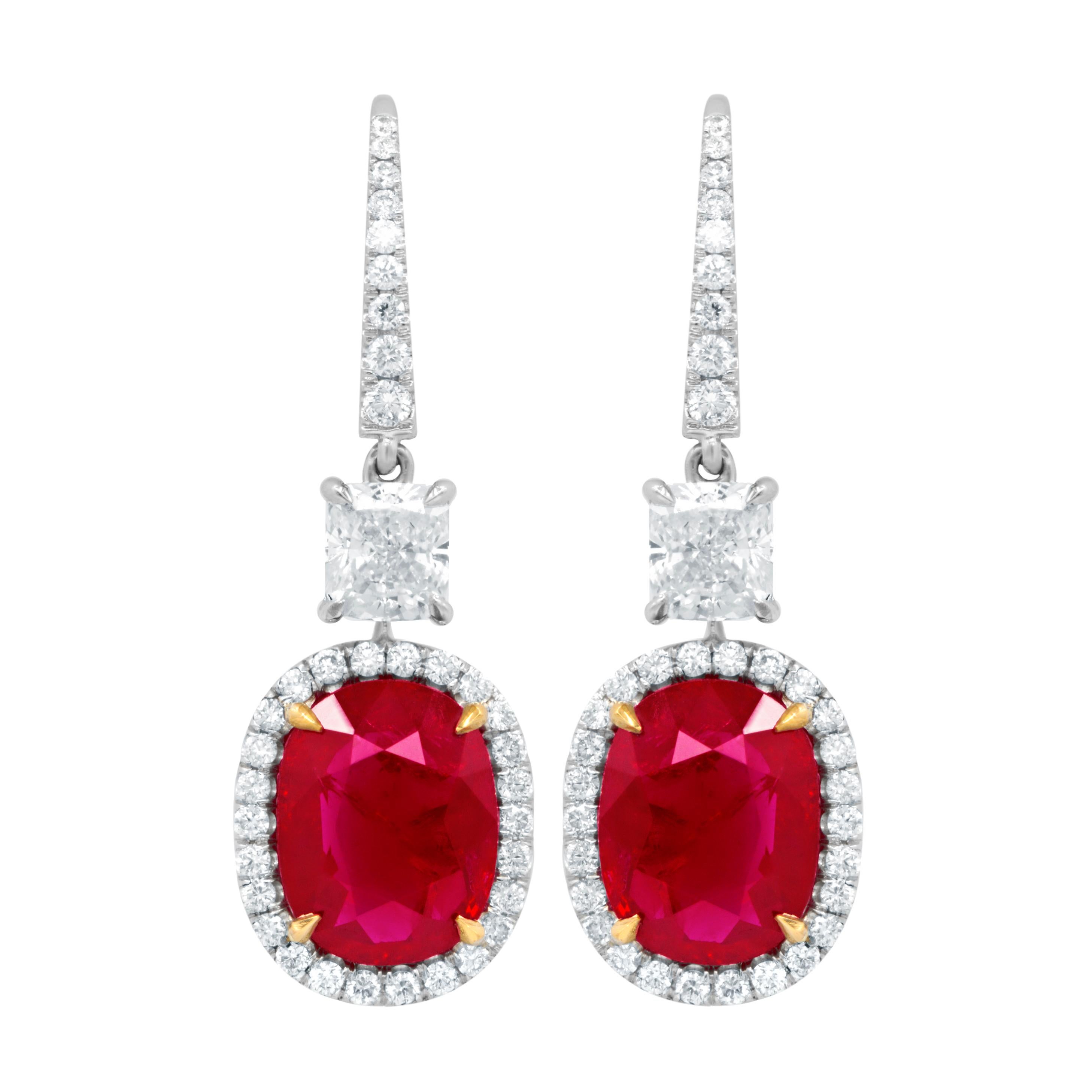 18kt White Gold Oval Shape Ruby Gia Certified Earrings Features: 6.68ct Ruby, Set In A Halo  With 2 Gia Certified Cushions With Total Of 1.85ct Of White Diamonds Around It
