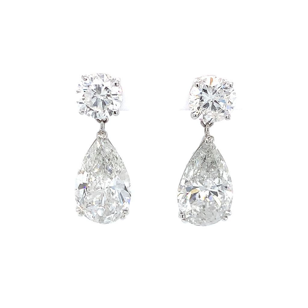 18kt White Gold Pear Diamond Drop Earrings. GIA Certified diamonds weigh 12.13ctw. F-H Color, I2-I3 Clarity.