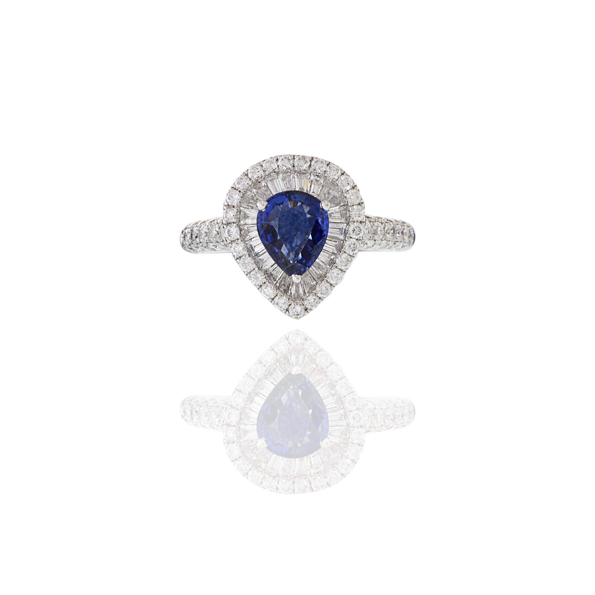 A timelessly elegant yet powerful ring crafted with 18KT white gold that features a stunning 1.24CT pear cut blue sapphire complemented by a striking 1.34CT-TW of GAL Certified G color VS1-VS2 clarity baguette and round cut diamonds. Size 6.25.