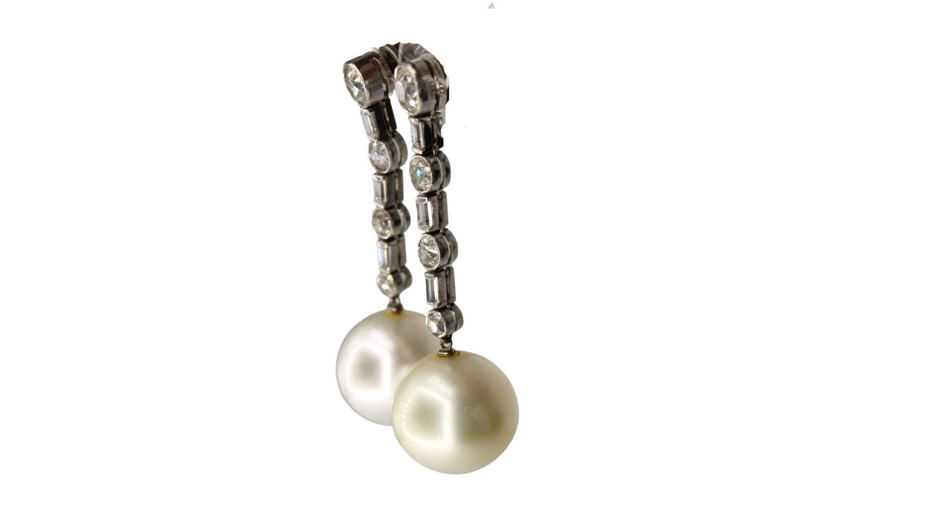 These Beautiful Estate Cultivate Natural South Sea Pearls Diamond Earrings Feature:
South Sea Pearl Shape :  Round
Total earring weight: 5.55 g
earring length: 4cm
Average Color/Surface : Light Golden-Cream/ Some Natural Flaws(see photos)
Pearl