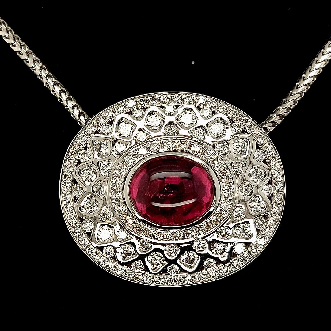 Very luxurious 18Kt White Gold Pendant Necklace With 7.72 Carat Pink rubellite Tourmaline, 5 Carat Diamonds 

Diamonds: Brilliant cut diamonds, together ca. 5 Ct

Tourmaline: Pink Rubellite tourmaline cabochon  7.72 Ct

Material: 18kt white