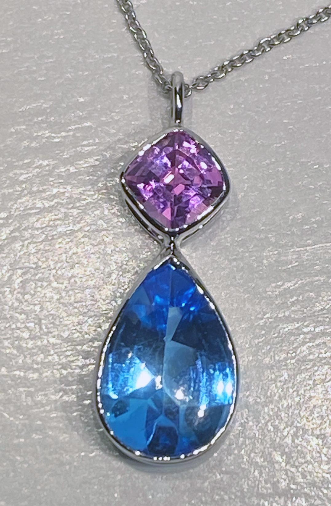 Mixed Cut 18kt White Gold Pendant Set with Blue Topaz & Pink Sapphire For Sale