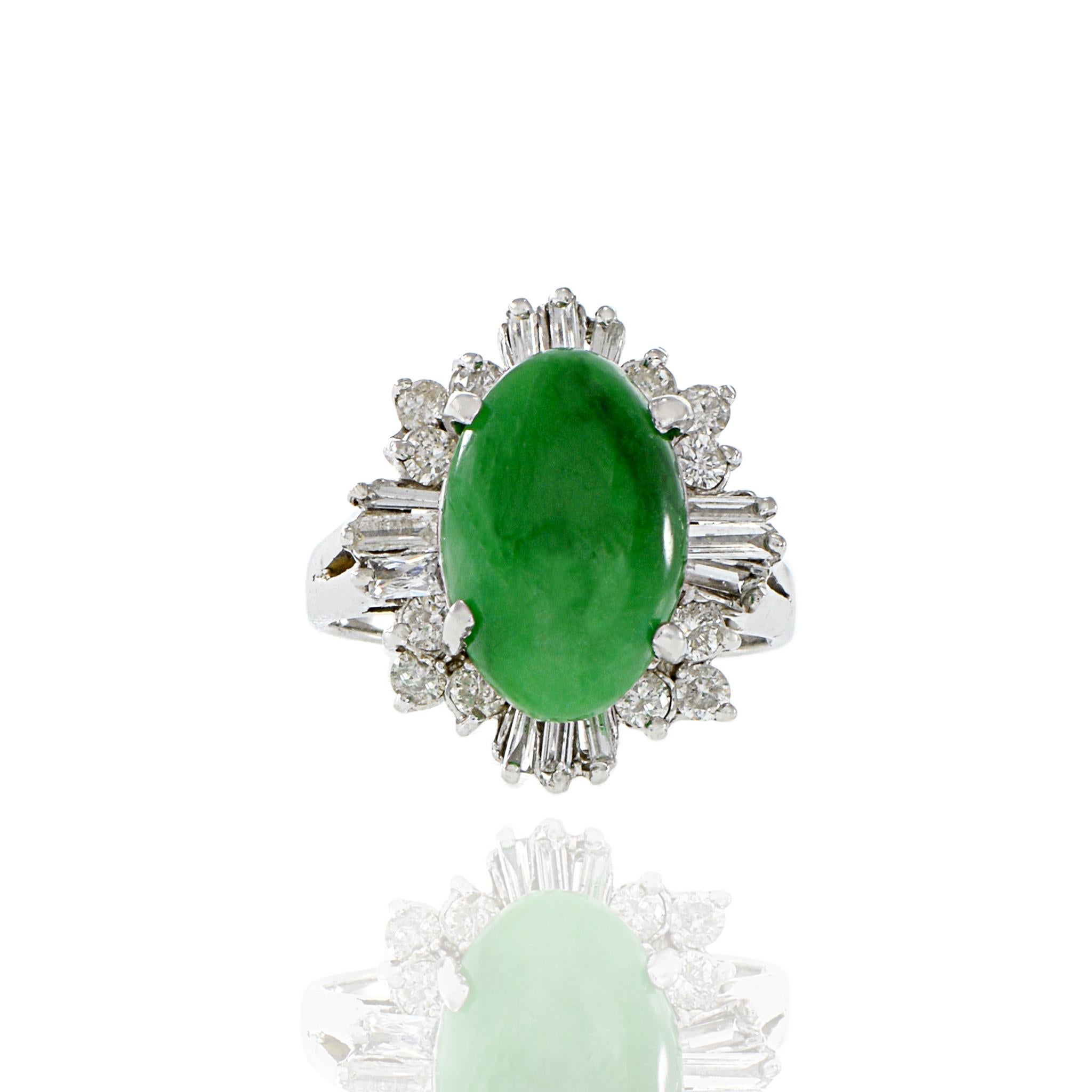 18KT white gold retro era cocktail ring consisting of genuine green jade surrounded by 1.30CT-TW of round brilliant and baguette cut diamonds. A timeless piece featuring luxurious 18KT white gold, genuine green jade, and 1.30CT-TW of high-quality