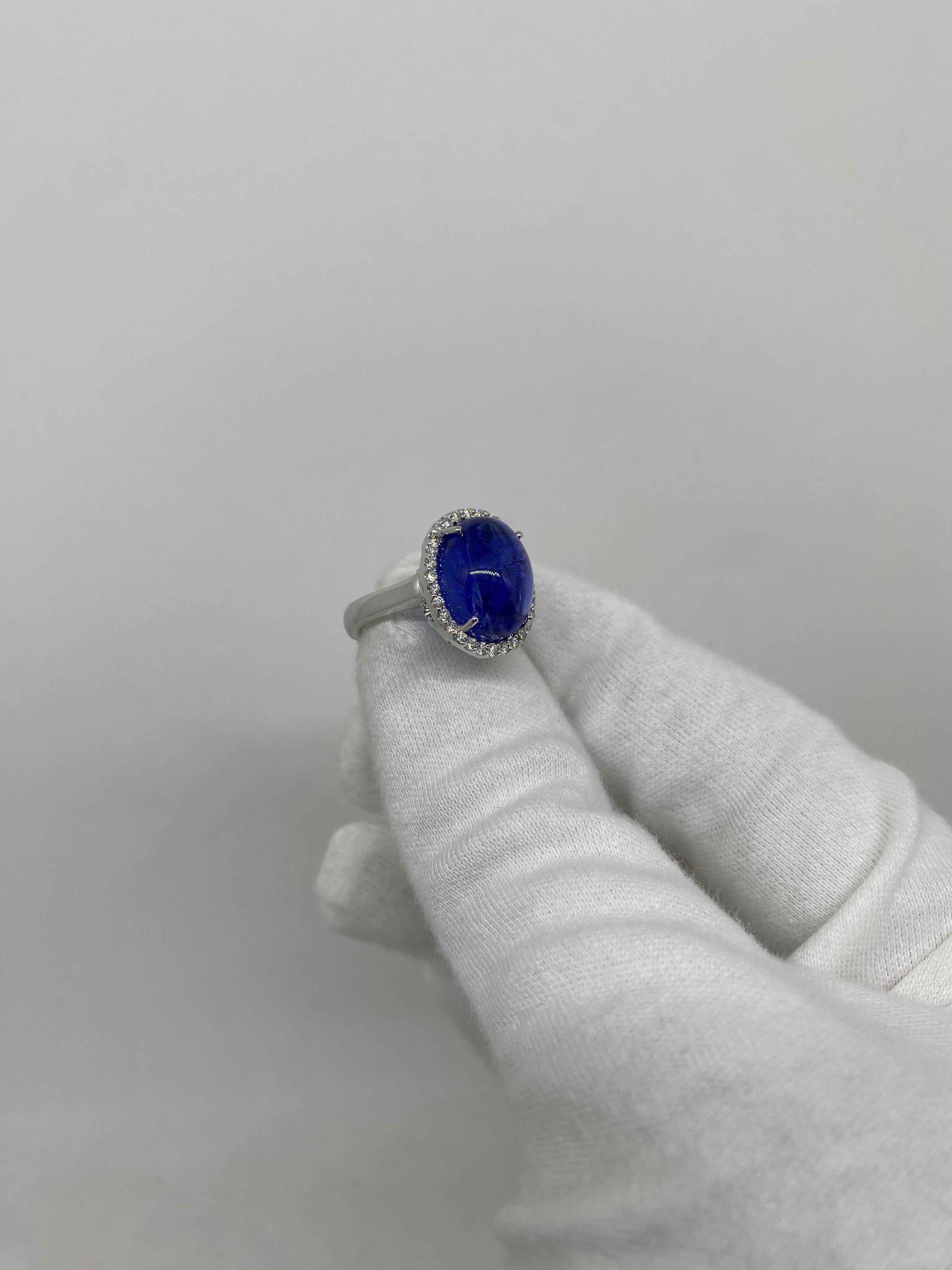 18 kt white gold ring with cabochon-cut tanzanite ct 10.43 surrounded by white natural diamonds totaling ct 0.35

Welcome to our jewelry collection, where every piece tells a story of timeless elegance and unparalleled craftsmanship. As a family-run