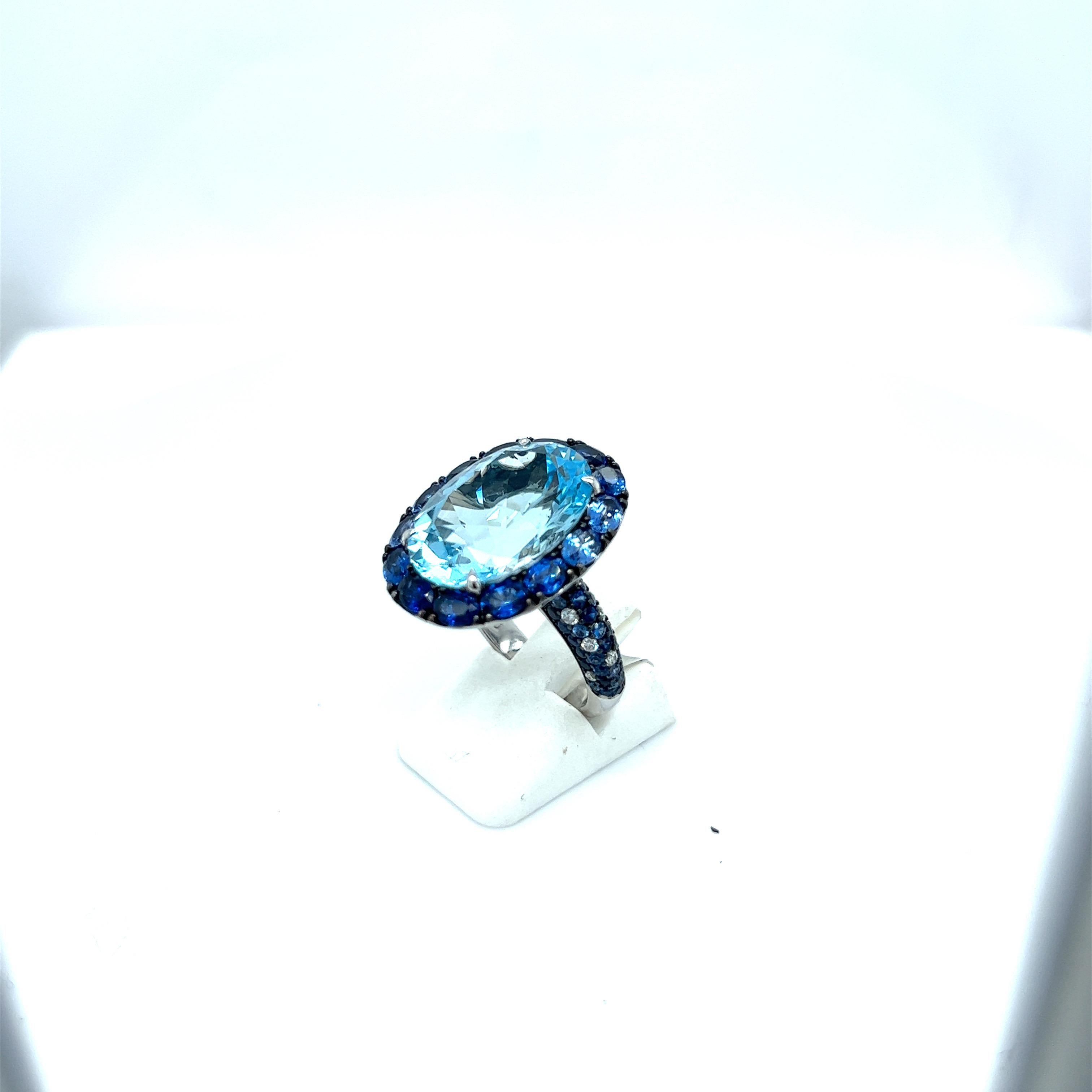 Modern 18kt White Gold Ring 13.46ct Bluetopaz, 3.51ct. Blue Sapphires, 0.14ct Diamond For Sale