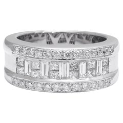 18kt. Bague en or blanc Diamants taille invisible brillants, émeraudes et baguettes 1,07ct