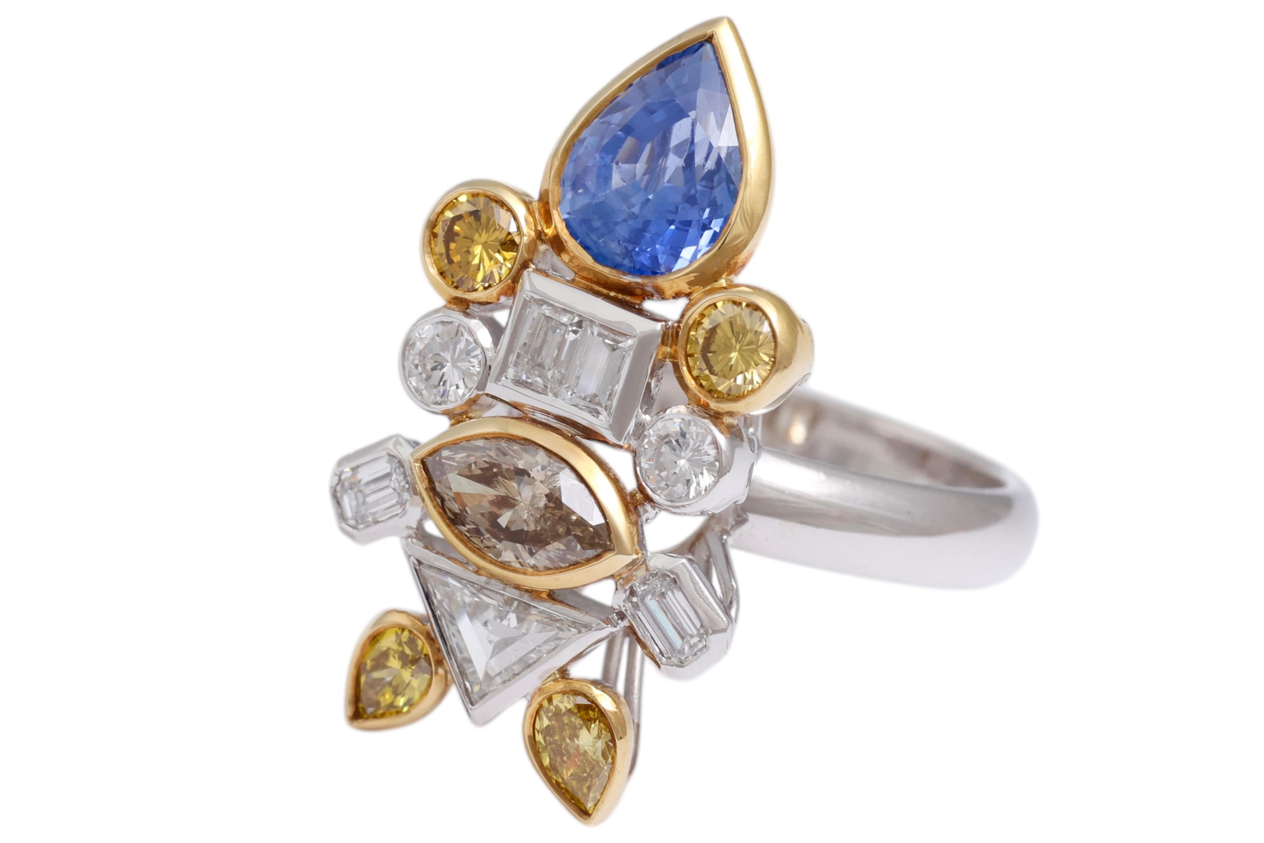 Unique and handcrafted beautiful ring depicting a fish set with diamonds and sapphires.

Diamonds & Fancy color diamonds : baguette cut, emerald cut, brilliant cut, triangle cut together 2.03 carat.

Sapphires: Pear shape natural Ceylon sapphire