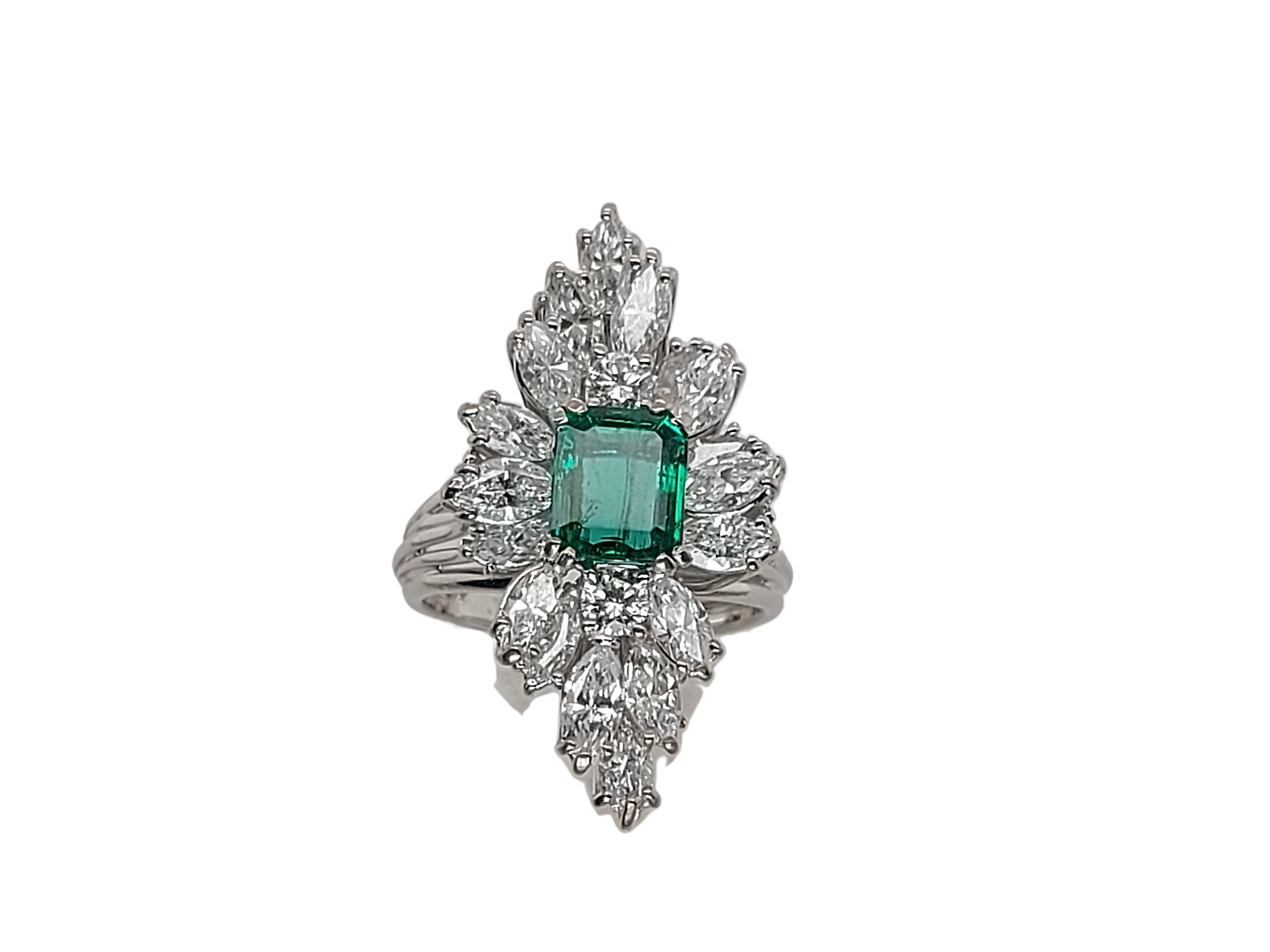 Artisan 18kt White Gold Ring with 1.49 Ct Emerald Stone Surrounded by Diamonds For Sale