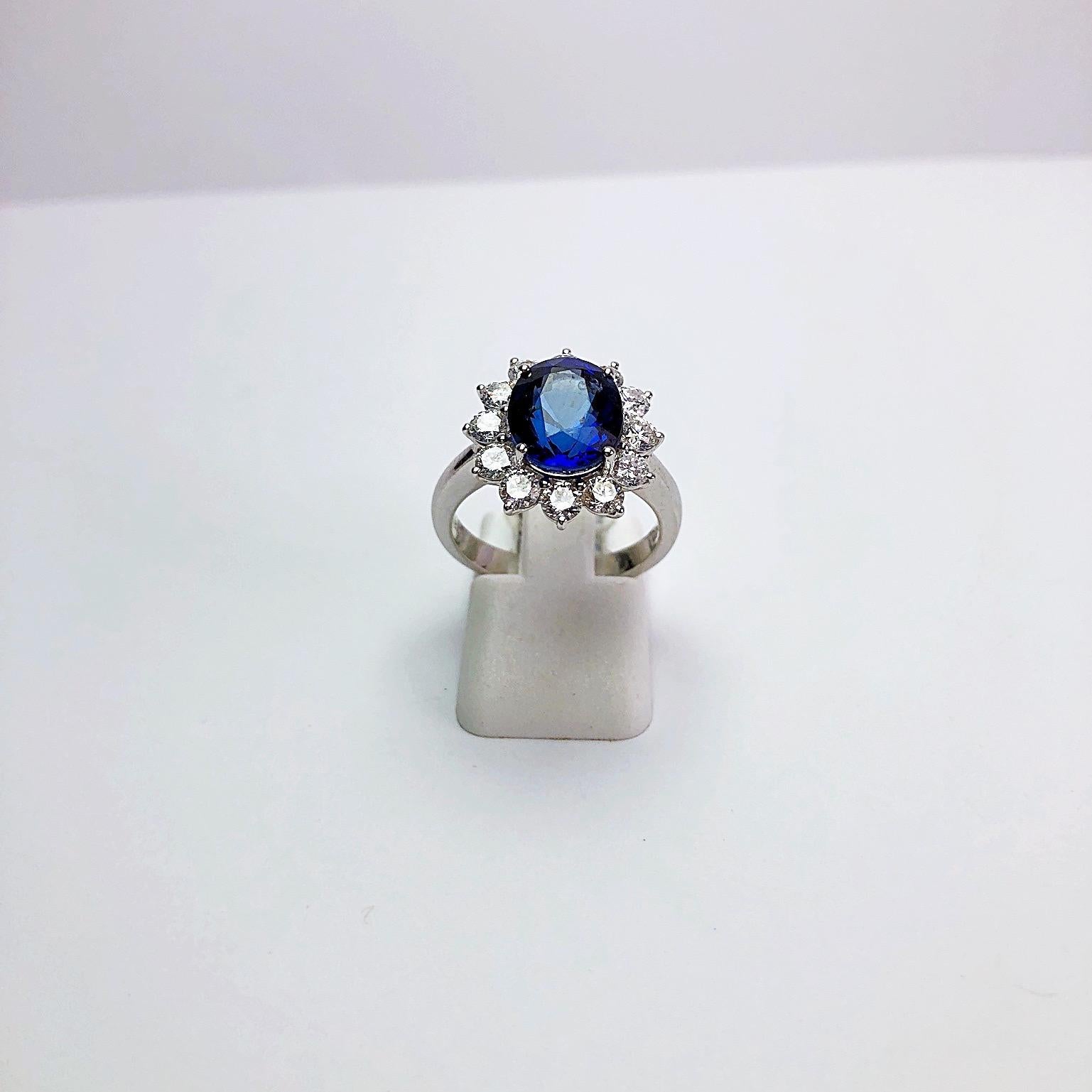 18 Karat Gold Ring mit 5,12 Karat ovalem blauem Saphir und 1,27 Karat Diamanten im Angebot 1