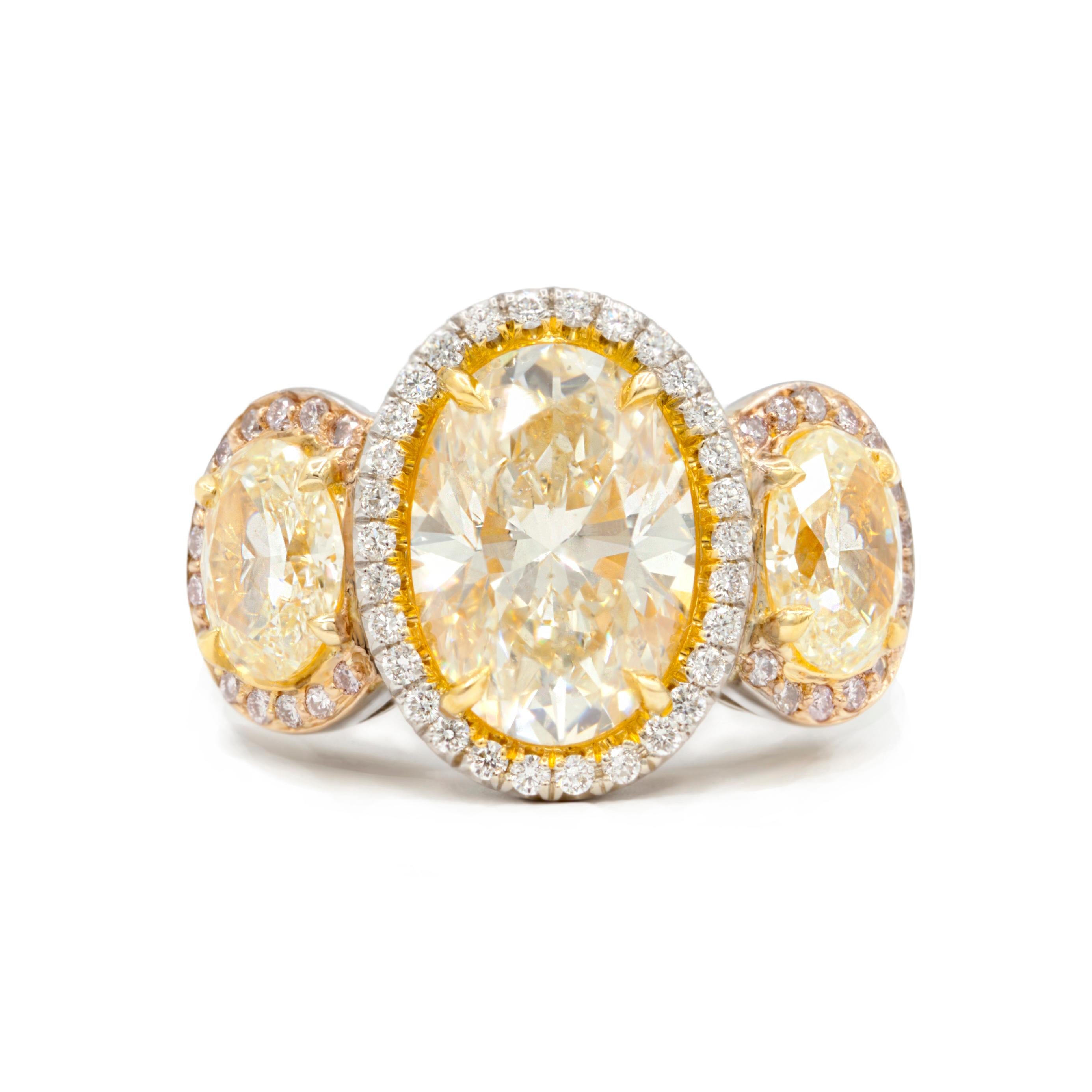 Round Cut 18kt White Gold Ring with Fancy Yellow Oval Center Diamond & White Diamond For Sale