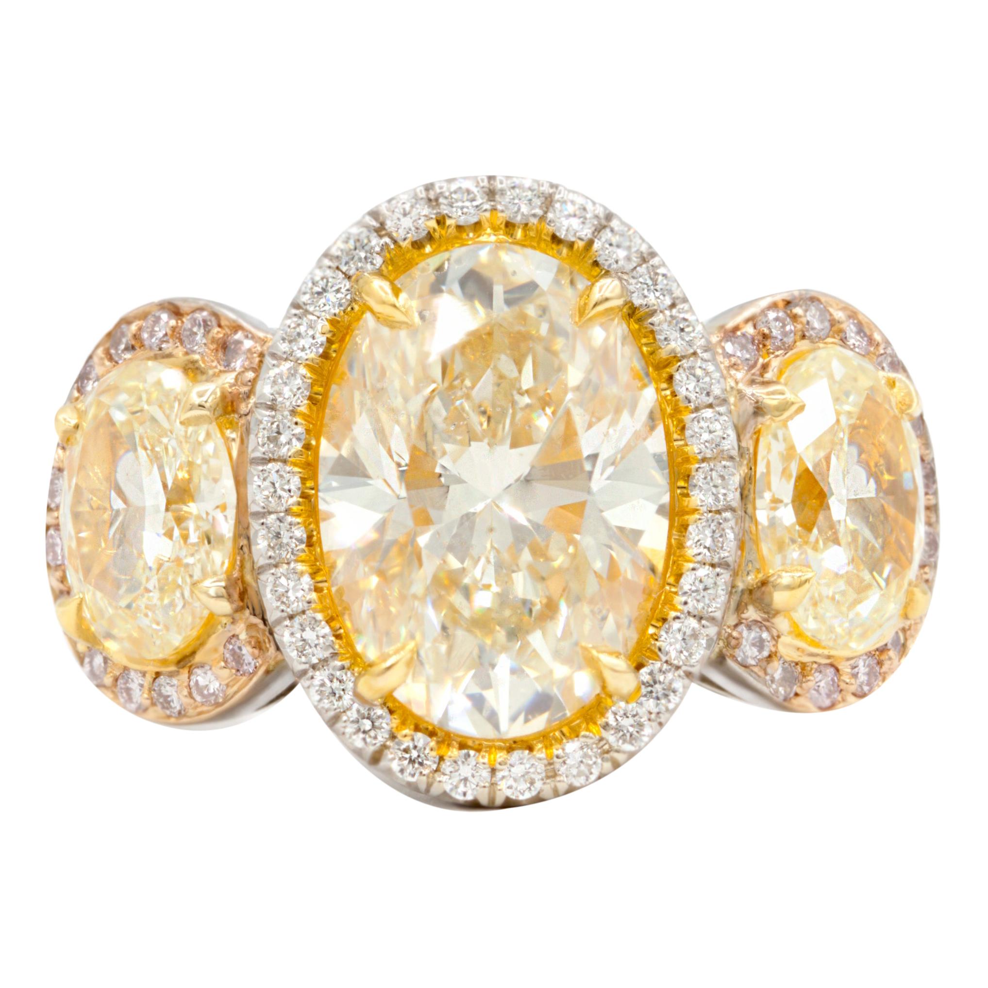 18kt White Gold Ring with Fancy Yellow Oval Center Diamond & White Diamond For Sale