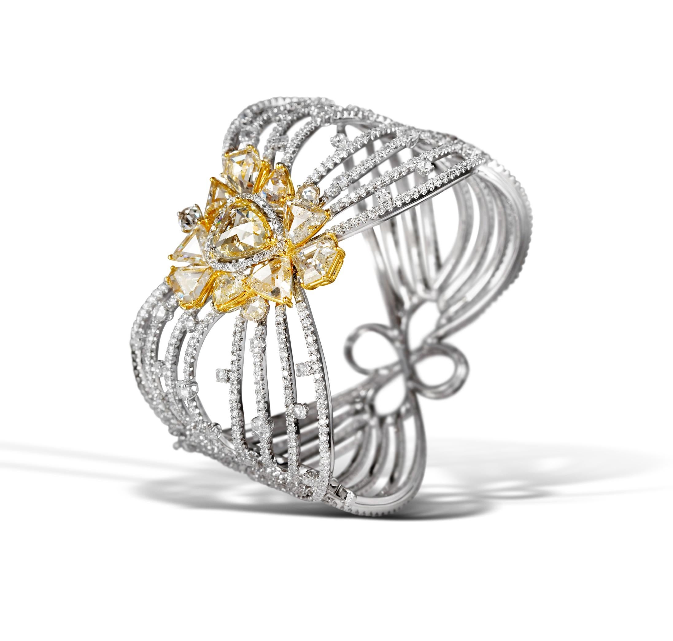 From our award winning COUTURE line. Designed by Samir Bhansali, this one of a kind convertible bangle features a beautiful combination of brilliant cut  diamonds (10.19cts) ,  yellow rose cut diamonds (10.33cts),  white  rose cut diamonds (2.29cts)