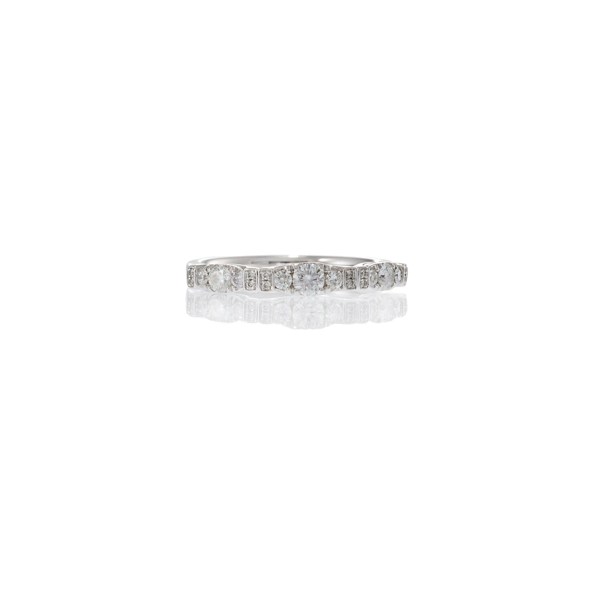 This elegant 18KT white gold ring features a distinctive alternating diamond pattern, set with 21 round cut diamonds totaling approximately 0.41 carats. The G-VS quality diamonds are expertly arranged to create a refined, vintage-inspired design,