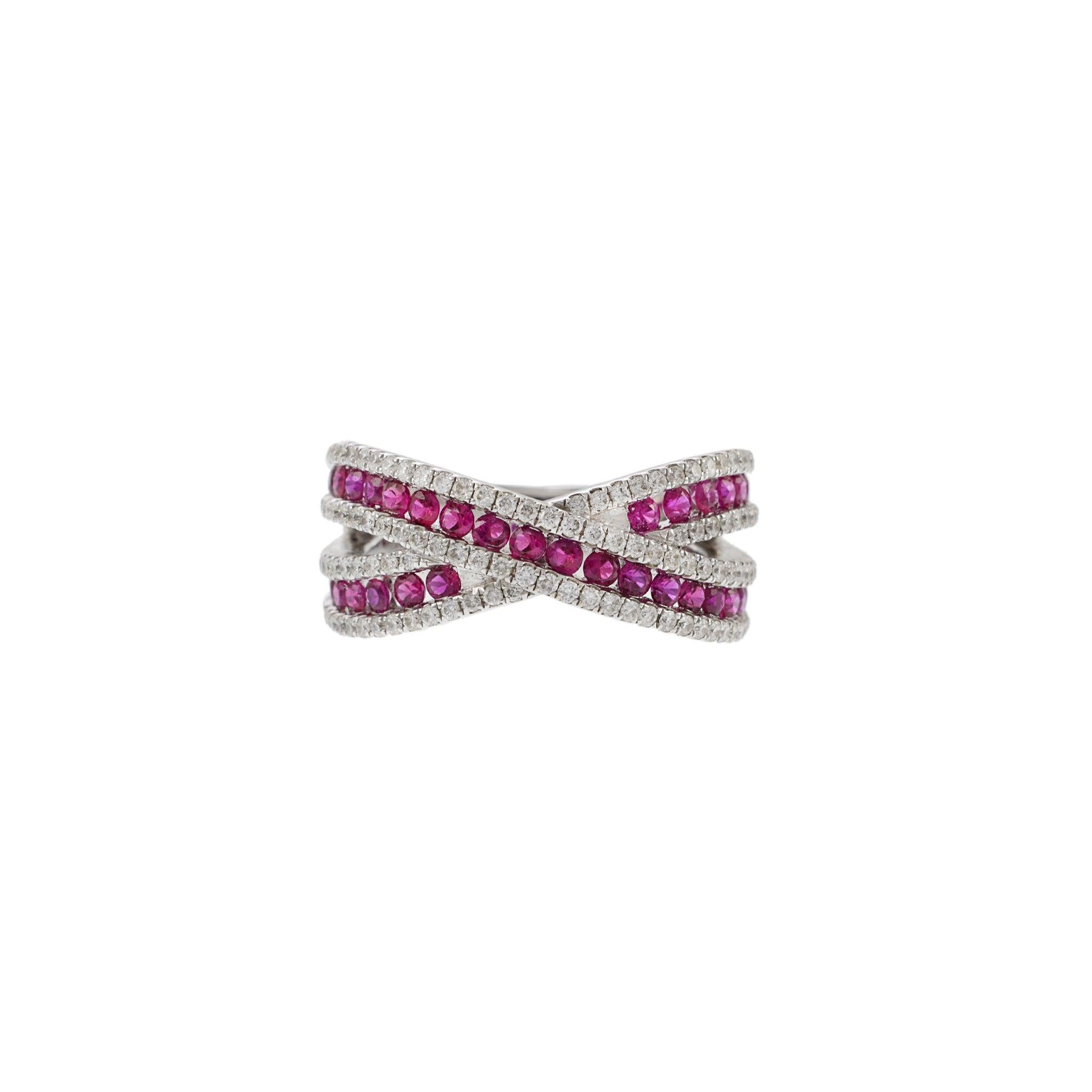 Crafted with high-quality 18KT white gold, this criss cross ring boasts a stunning 1.00CT-TW rubies and 0.55CT-TW F-G Color VS1-VS2 Clarity round cut diamonds. The perfect combination of timeless elegance and luxurious design. 9.8 grams. Size 6.5 US.
