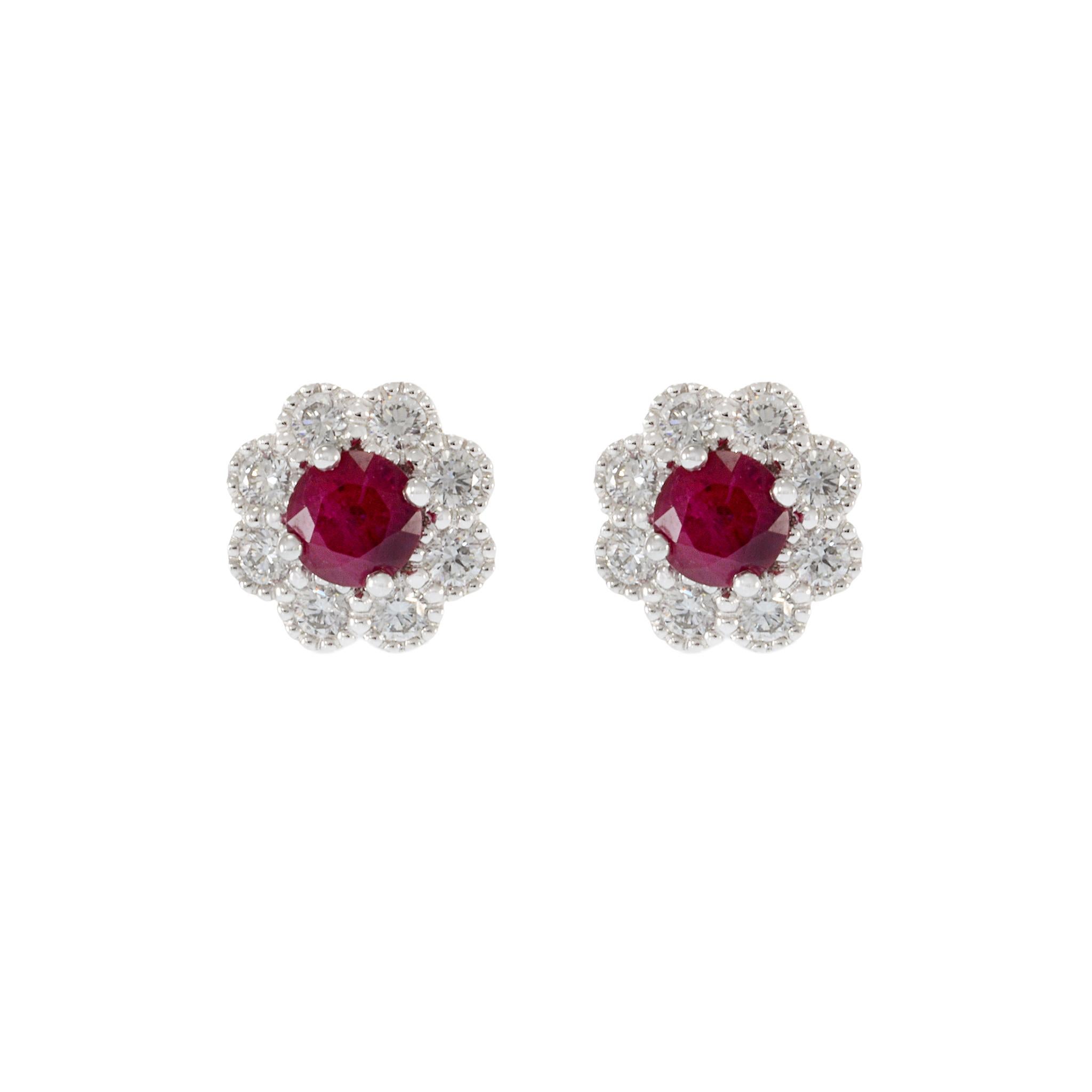 Experience opulence with our 18KT White Gold Ruby and Diamond Flower Earrings. With vibrant Rubies totaling 0.91 carats and sparkling diamonds totaling 0.46ct, these earrings showcase luxurious craftsmanship. Each earring weighs 3.68 grams, adding