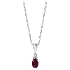 Colgante de oro blanco de 18 quilates con rubíes y diamantes