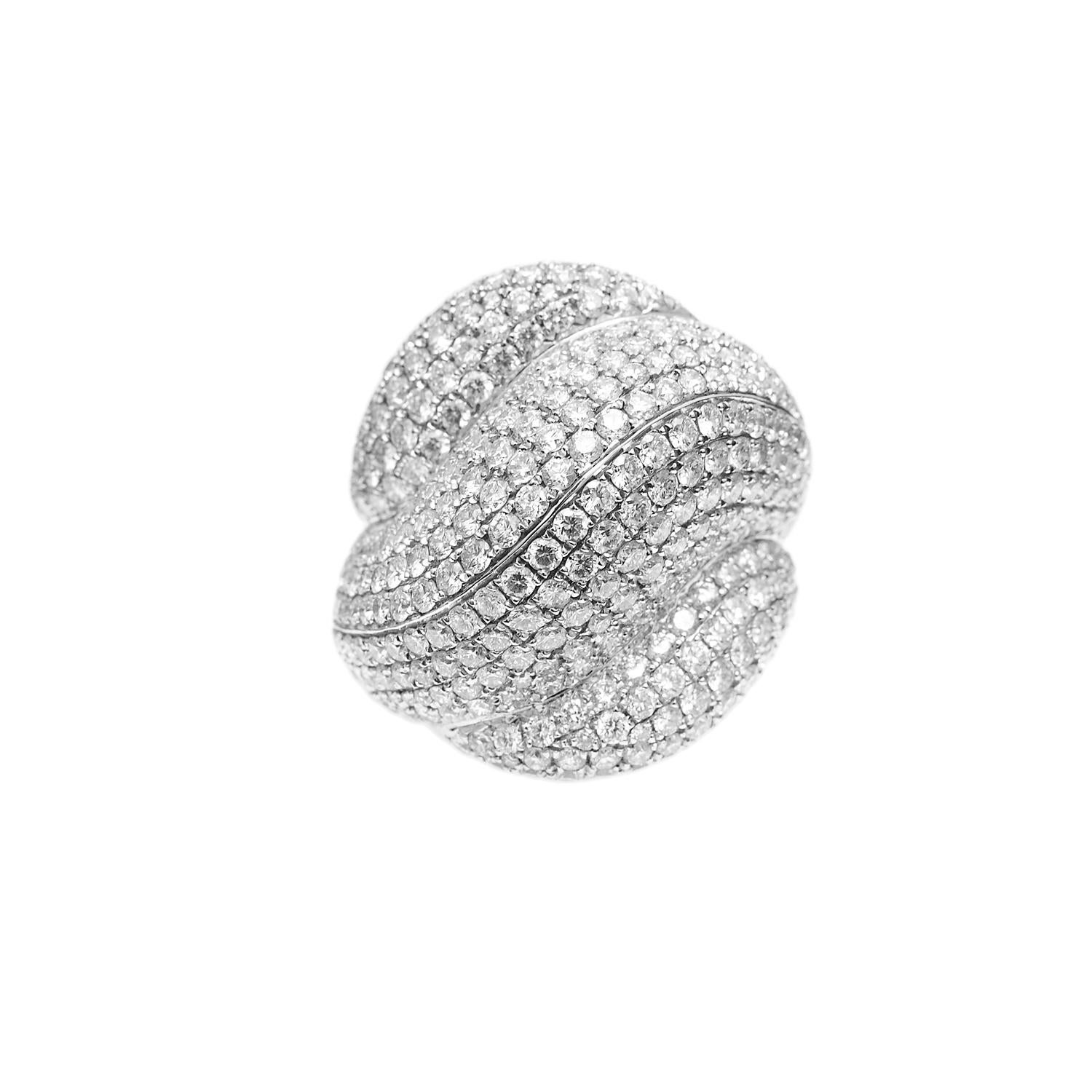 Want to be bold and glitzy? Need a Statement cocktail ring? We have you covered. This delicately hand-crafted piece shows of its curve in bright shining diamond pavé with 5.6ct of diamonds.
