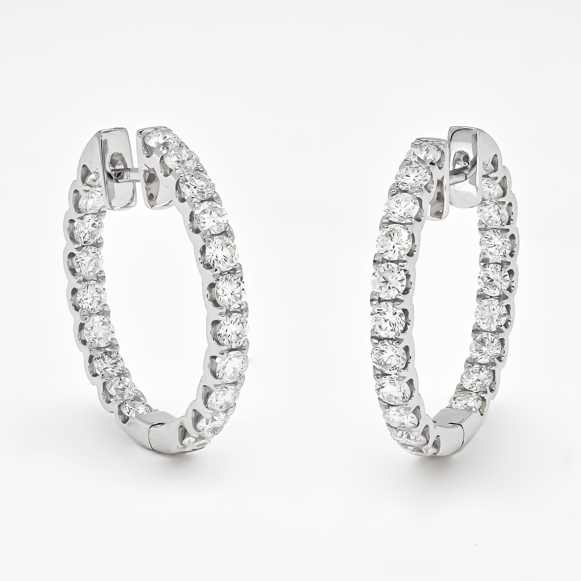 Introducing our extraordinary 18KT White Gold Single Row Diamond In and Out Hoop Huggies Earring! This remarkable piece is not only a stunning accessory but also the perfect anniversary gift or an earring for all occasions.

The brilliant-cut