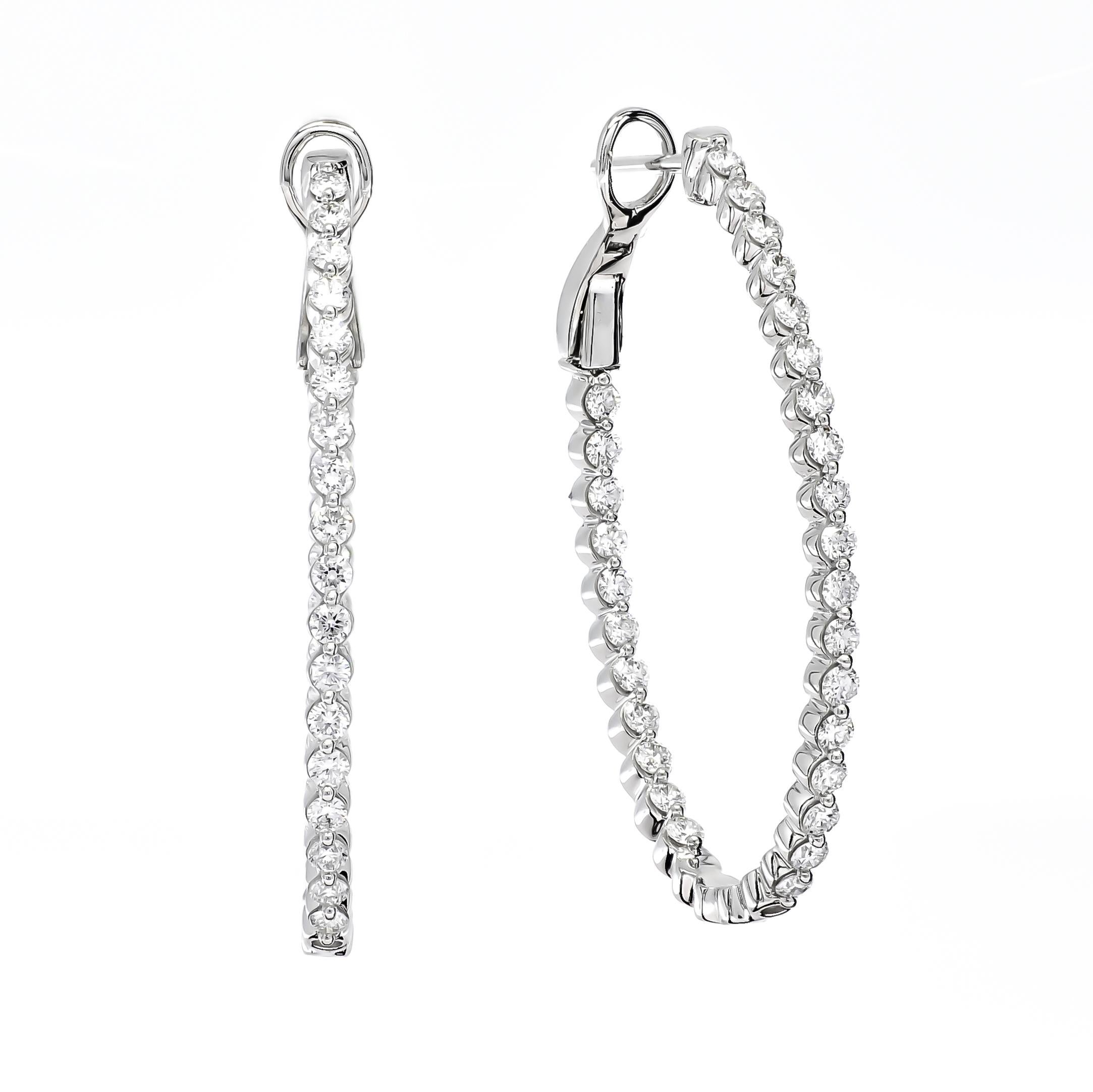 An Elegant 18 KT Set Hoop earring gives a dainty look! Diamond hoop earrings are a classic and tasteful choice for the sophisticated woman. So versatile, these hoops captivate diamonds and a bright polished shine in and out setting, giving it a