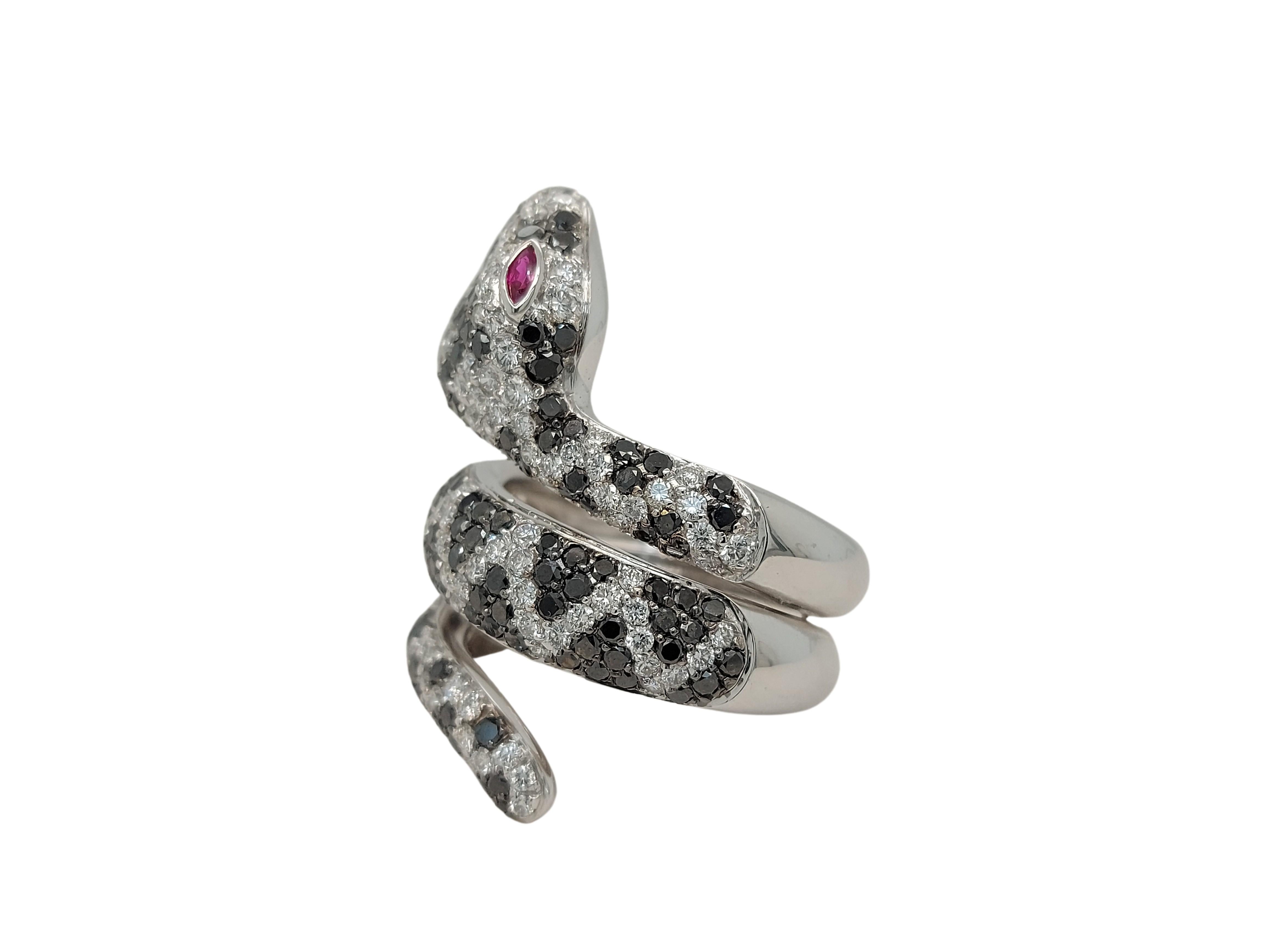 Magnificent 18kt White Gold Snake Ring with 2.04ct Black & 1.75ct White Diamonds & Ruby Eyes

Material: 18kt white gold

Diamonds: 1.75ct white brilliant cut diamonds  and 2.04ct black diamonds

Ruby: 2 little Ruby eyes

Total weight: 21.2 gr /