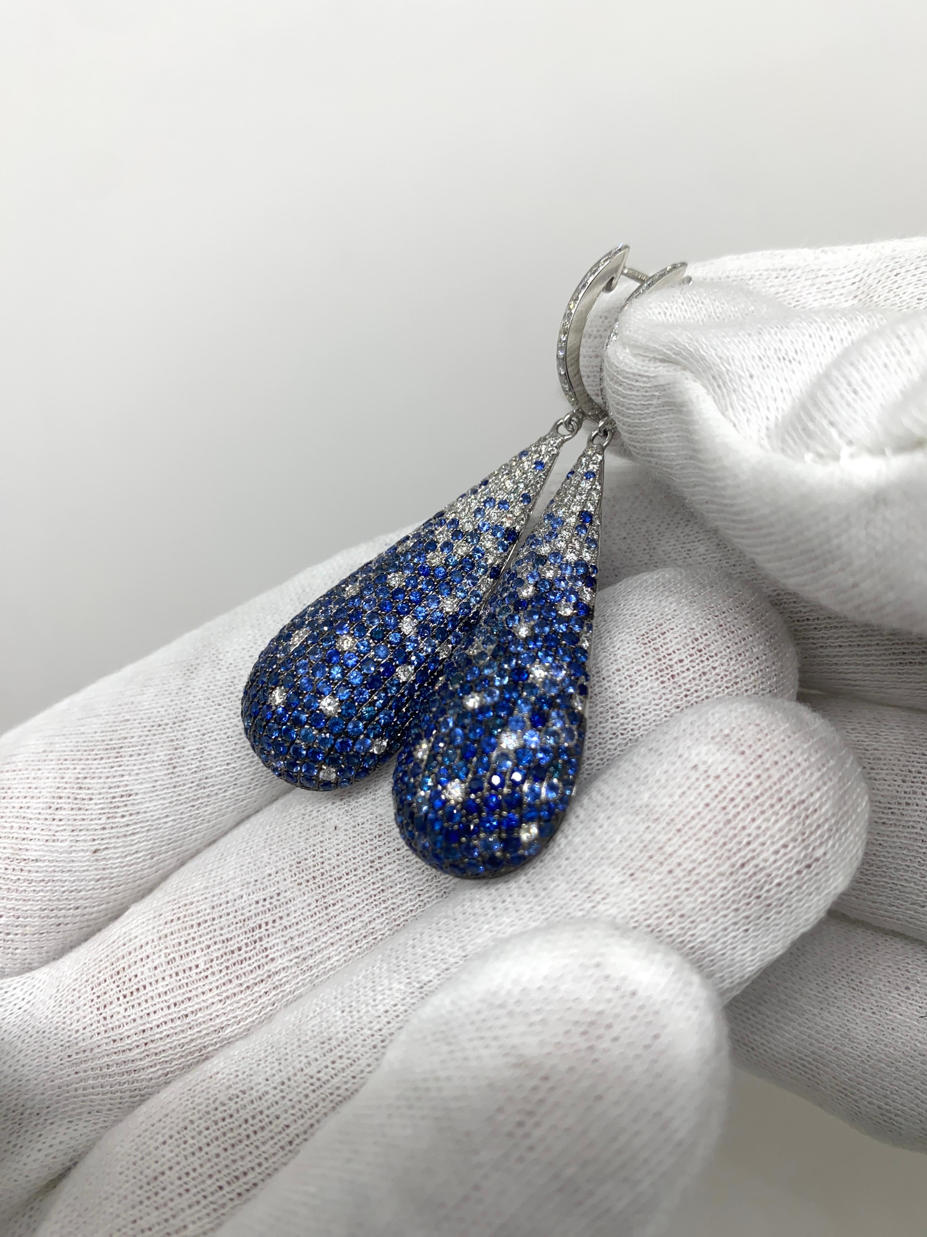 Dangling earrings made of 18kt white gold with natural brilliant-cut blue sapphires for ct.5.62 and natural brilliant-cut white diamonds for ct.1.42

Welcome to our jewelry collection, where every piece tells a story of timeless elegance and