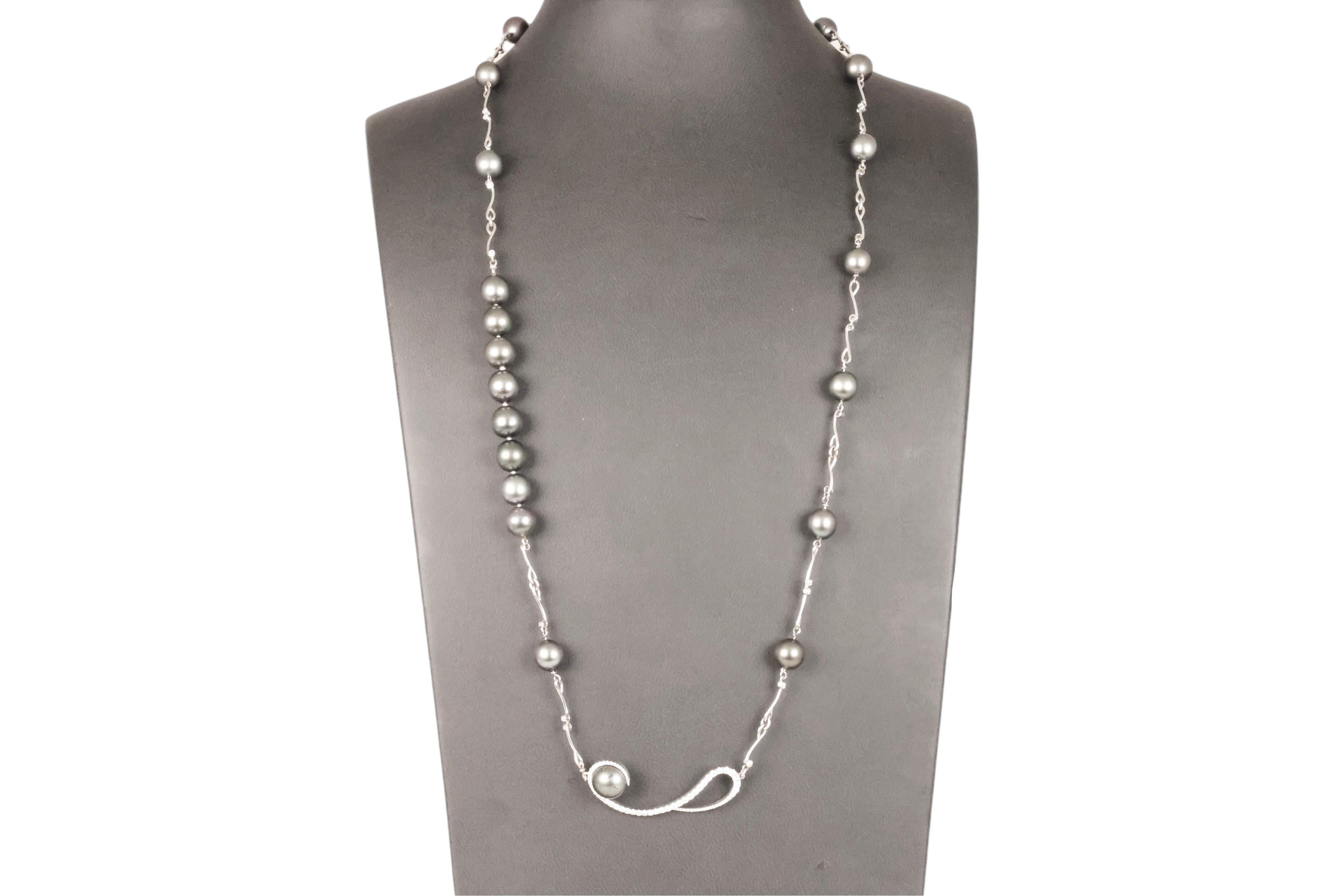 Gorgeous 18kt White Gold Tahitian Pearl Necklace with 2.24 ct Brilliant cut Diamonds 

Pearls: 21 Dark grey Tahitian pearls diameter 10.5 mm, 1 big pearl diameter 12.5 mm

Diamonds: Brilliant cut diamonds together approx. 2.24 ct.

Material: 18 kt.