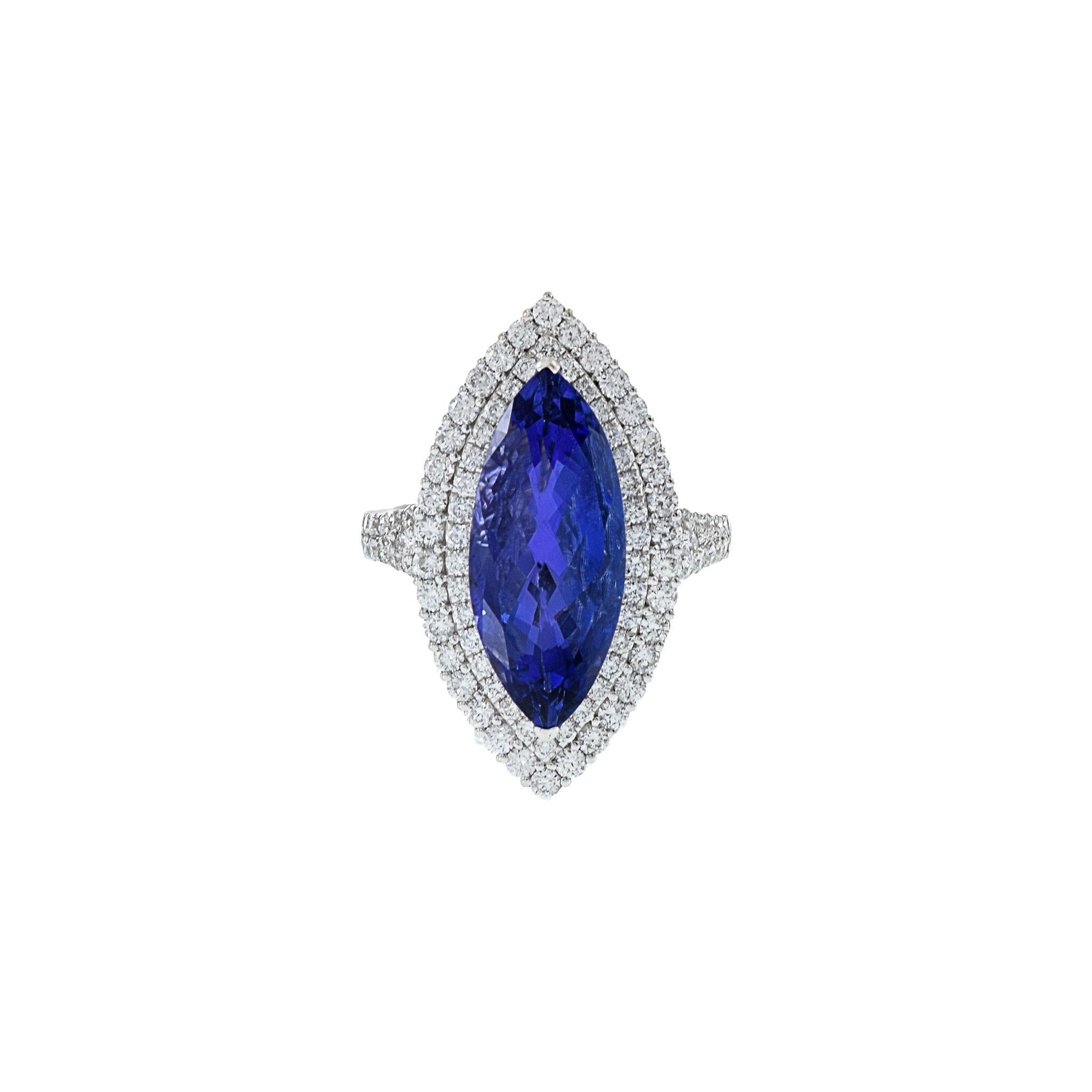 This opulent ring is a true showstopper, crafted with 18KT white gold and featuring a resplendent 6.81CT marquise-cut tanzanite. The tanzanite is complemented by a dazzling array of 1.25CT-TW F-G color and VS/I clarity round-cut diamonds, ensuring a