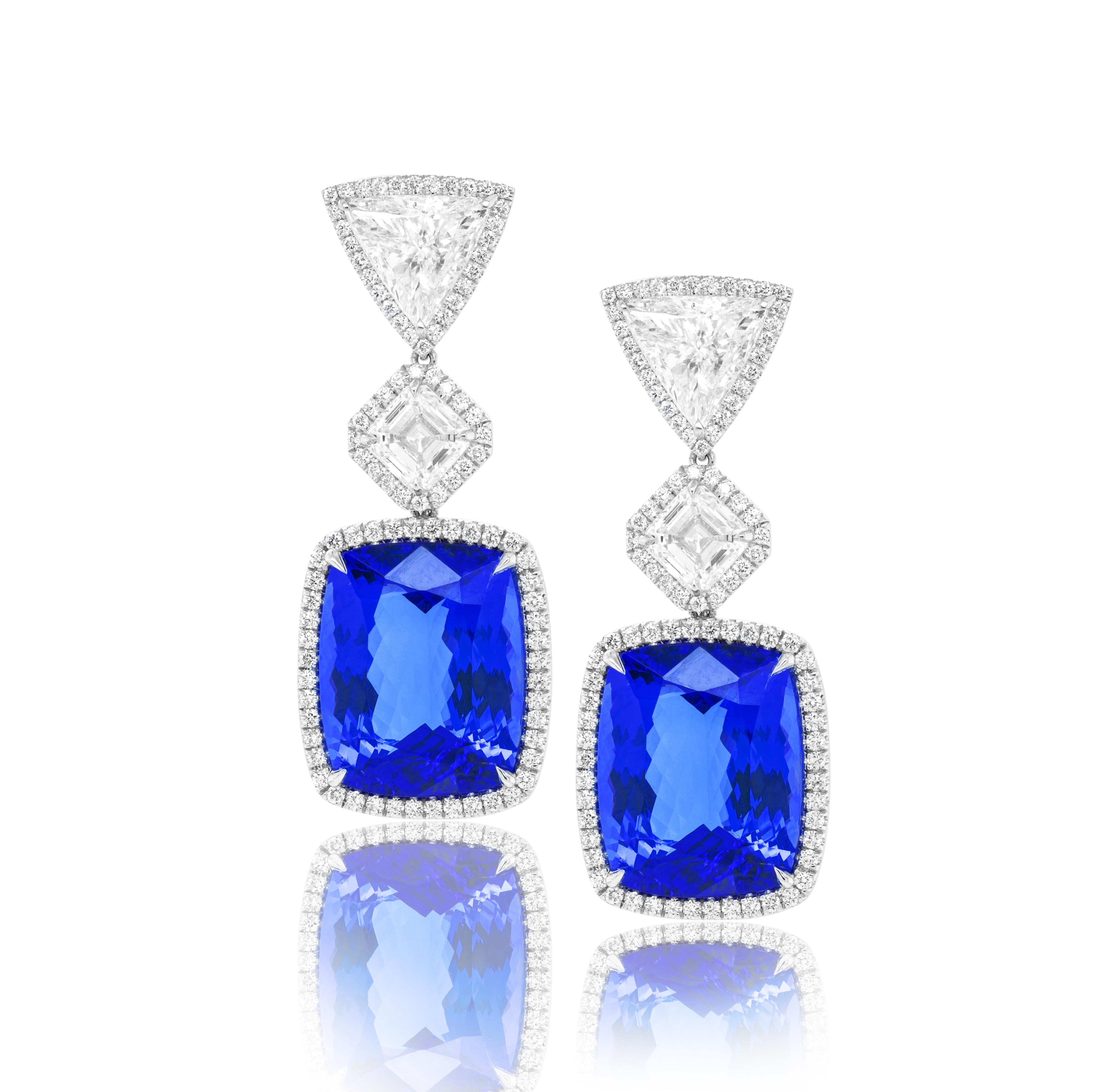 18kt white gold tanzanite and diamonds earrings, features 33.79 gia certifed tanzanites (16.89ct & 16.90ct) and 2.62ct  gia certified asscher cuts diamonds (1.32 i-vs2 ass+1.30i-vs2 ass) and 3.06ct of two trillians diamonds surrounded by 1.77ct of
