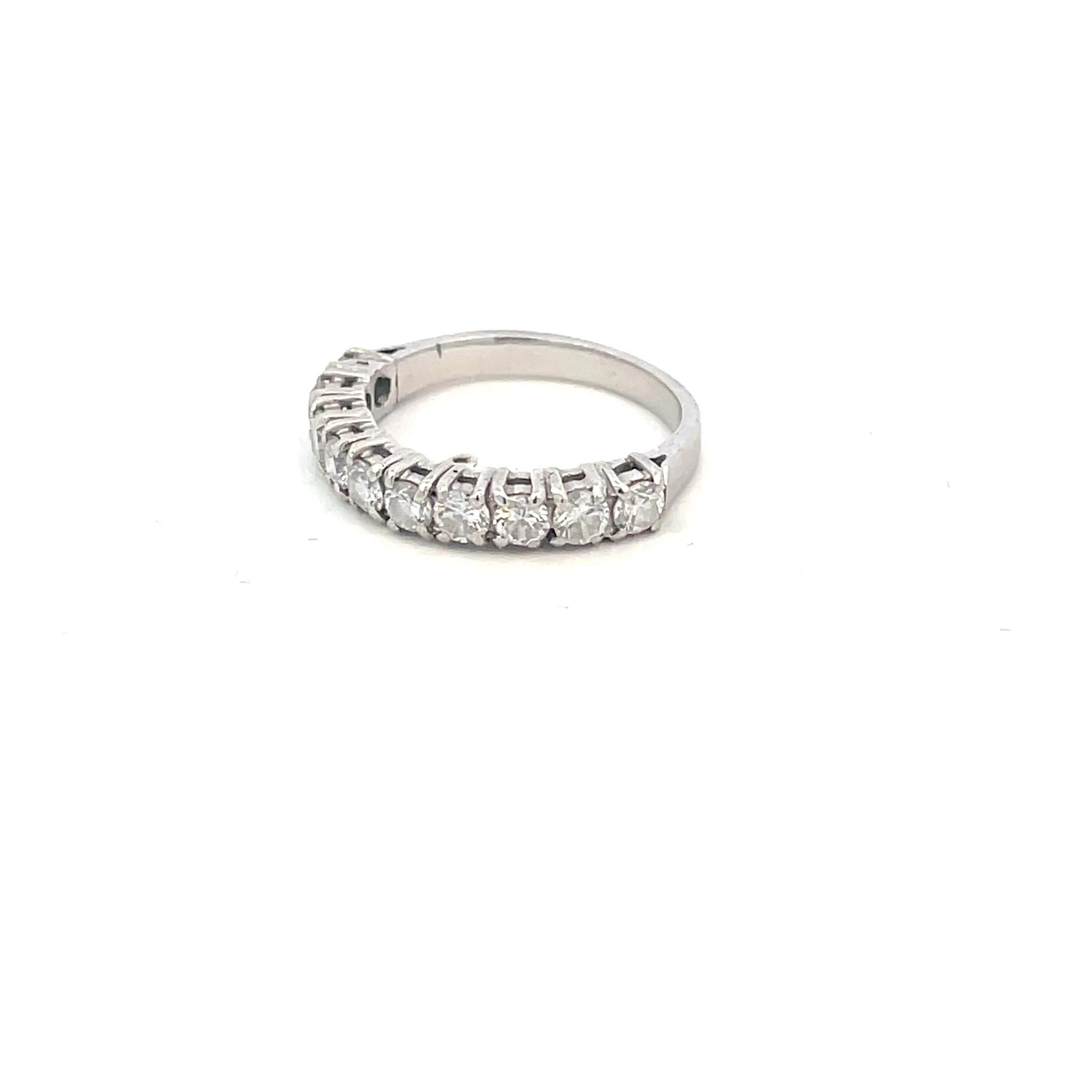 A diamond half eternity platinum ring, the ten round brilliant-cut diamonds weights all about 0.07 cts each ,  estimated to weigh 0.70 carats in total, all claw set to an 18Kt White Gold mount.

This ring is in excellent condition.

This classic and