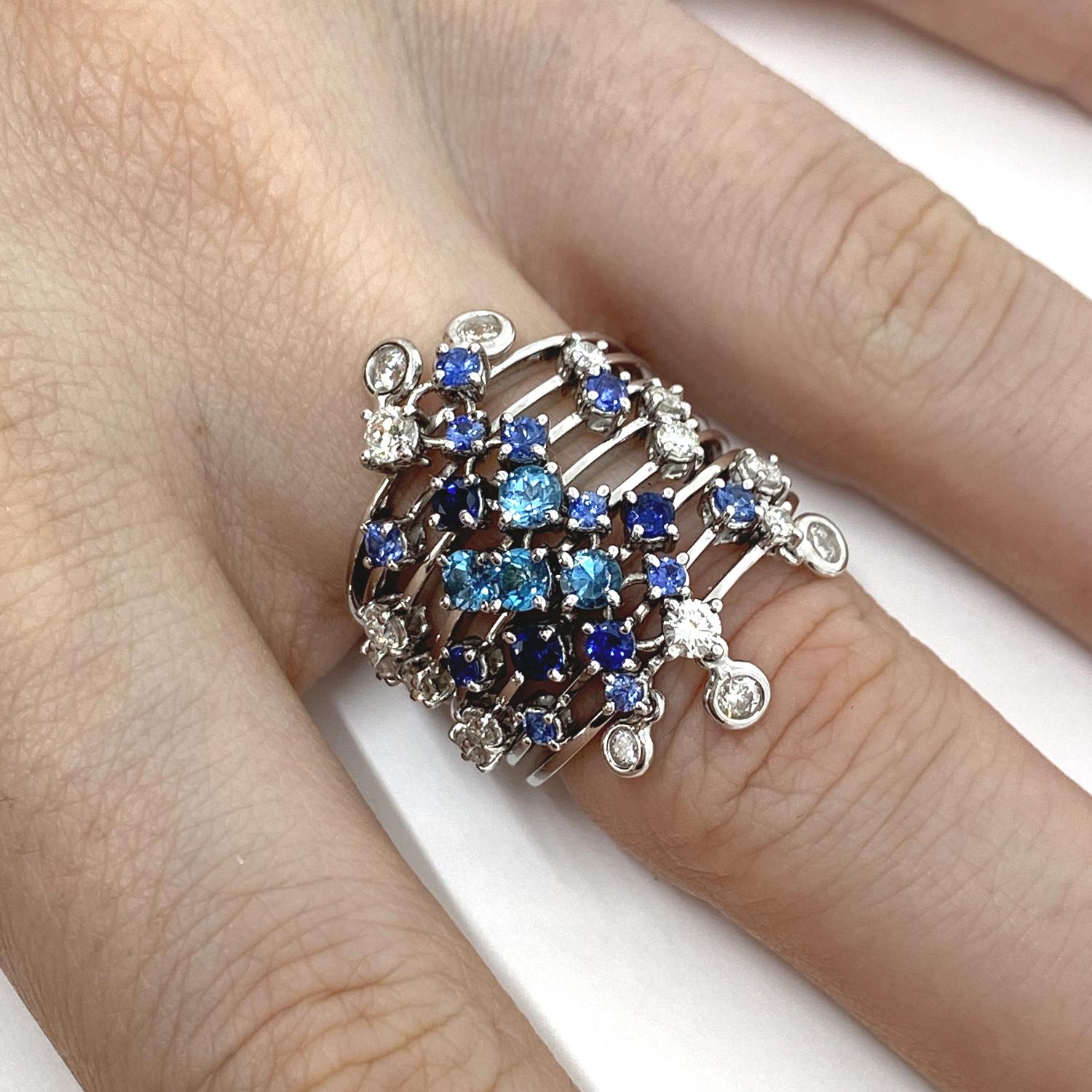 Ring made of eight 18kt white gold bands with natural brilliant-cut sapphires for ct.0.83 and white diamonds for ct.0.77 and topazes for ct .0.50

Welcome to our jewelry collection, where every piece tells a story of timeless elegance and