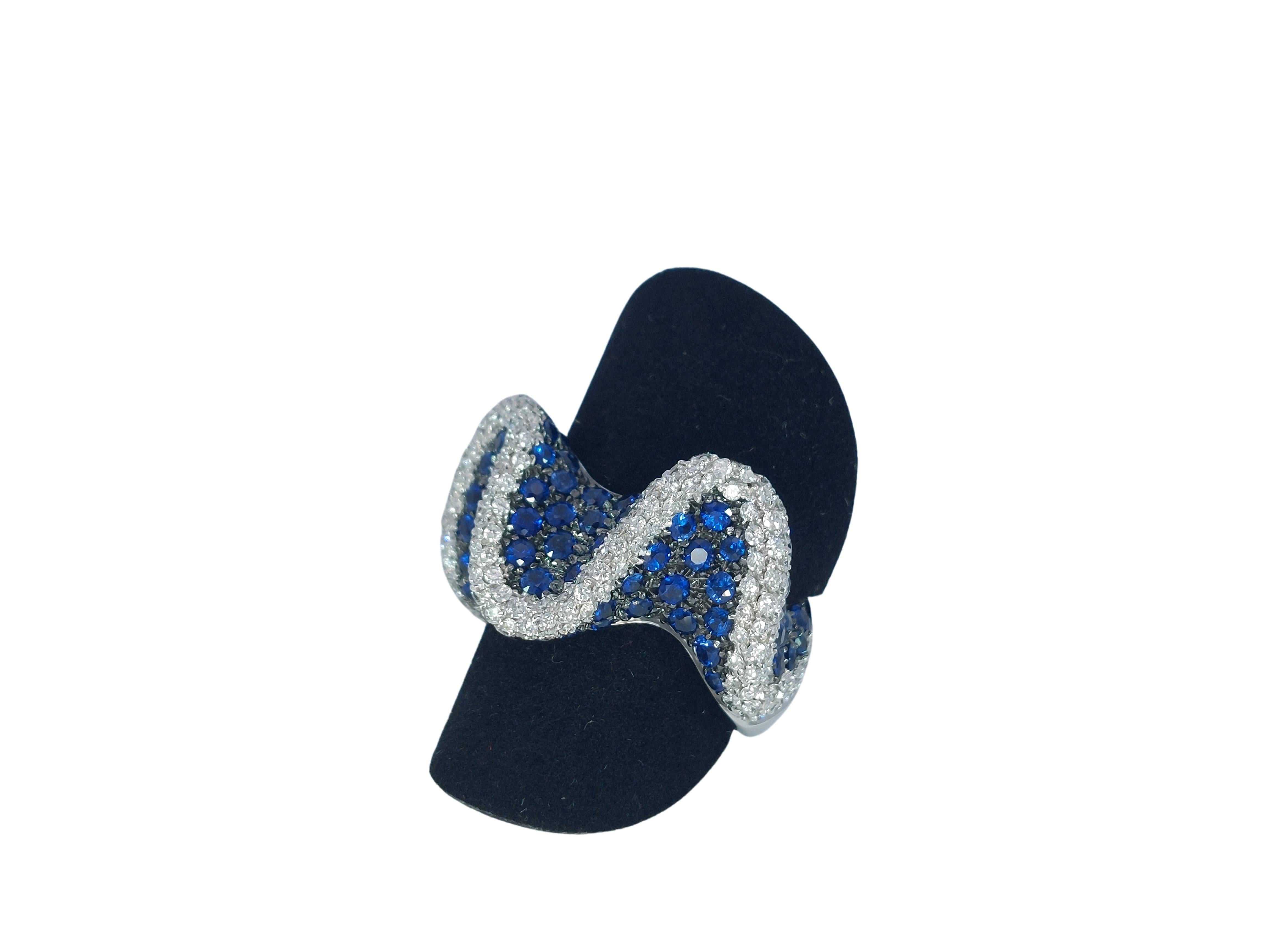 Brilliant Cut 18kt White Gold Wavy Ring with 2.6ct Diamonds & 2.8ct Blue Sapphires For Sale