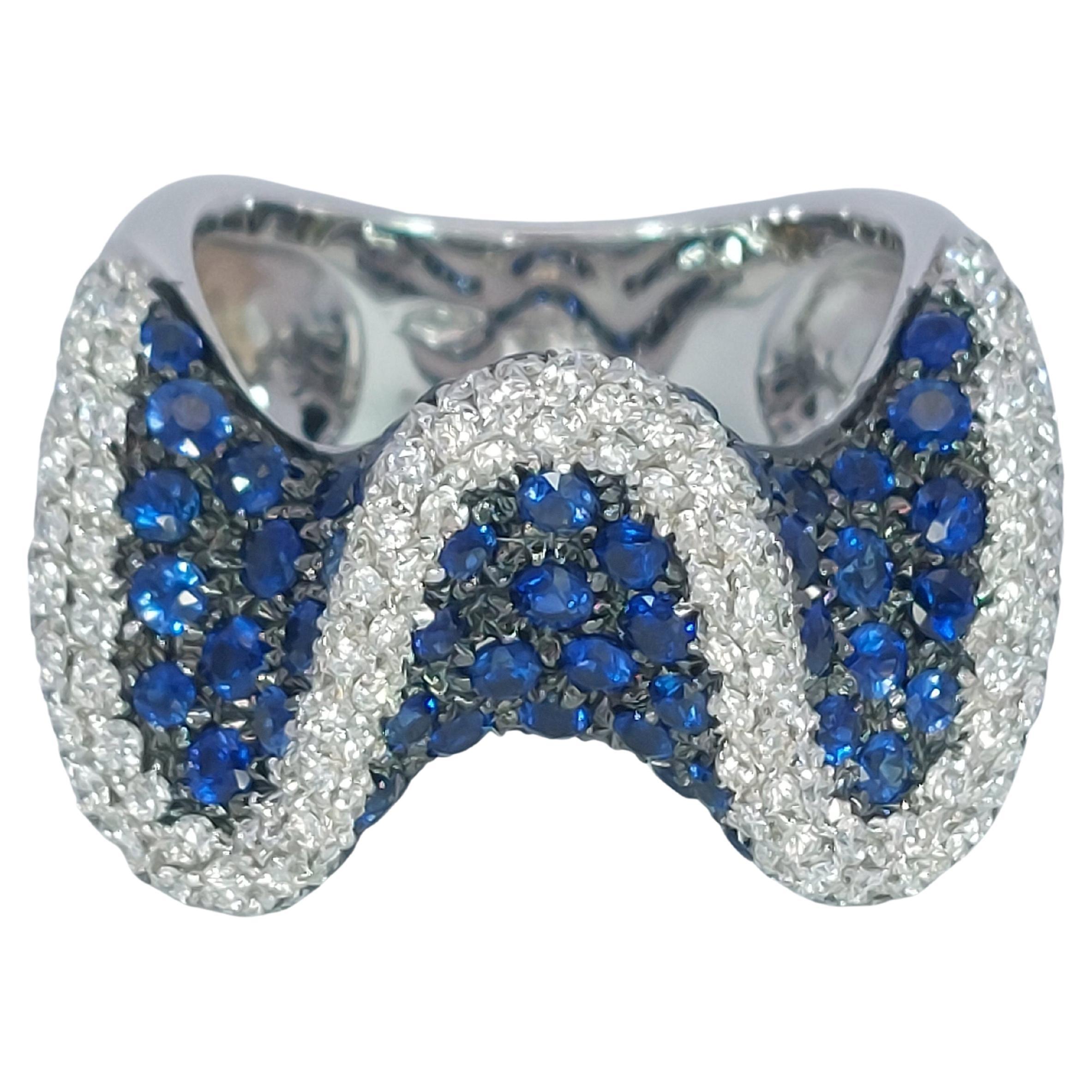 18kt White Gold Wavy Ring with 2.6ct Diamonds & 2.8ct Blue Sapphires For Sale