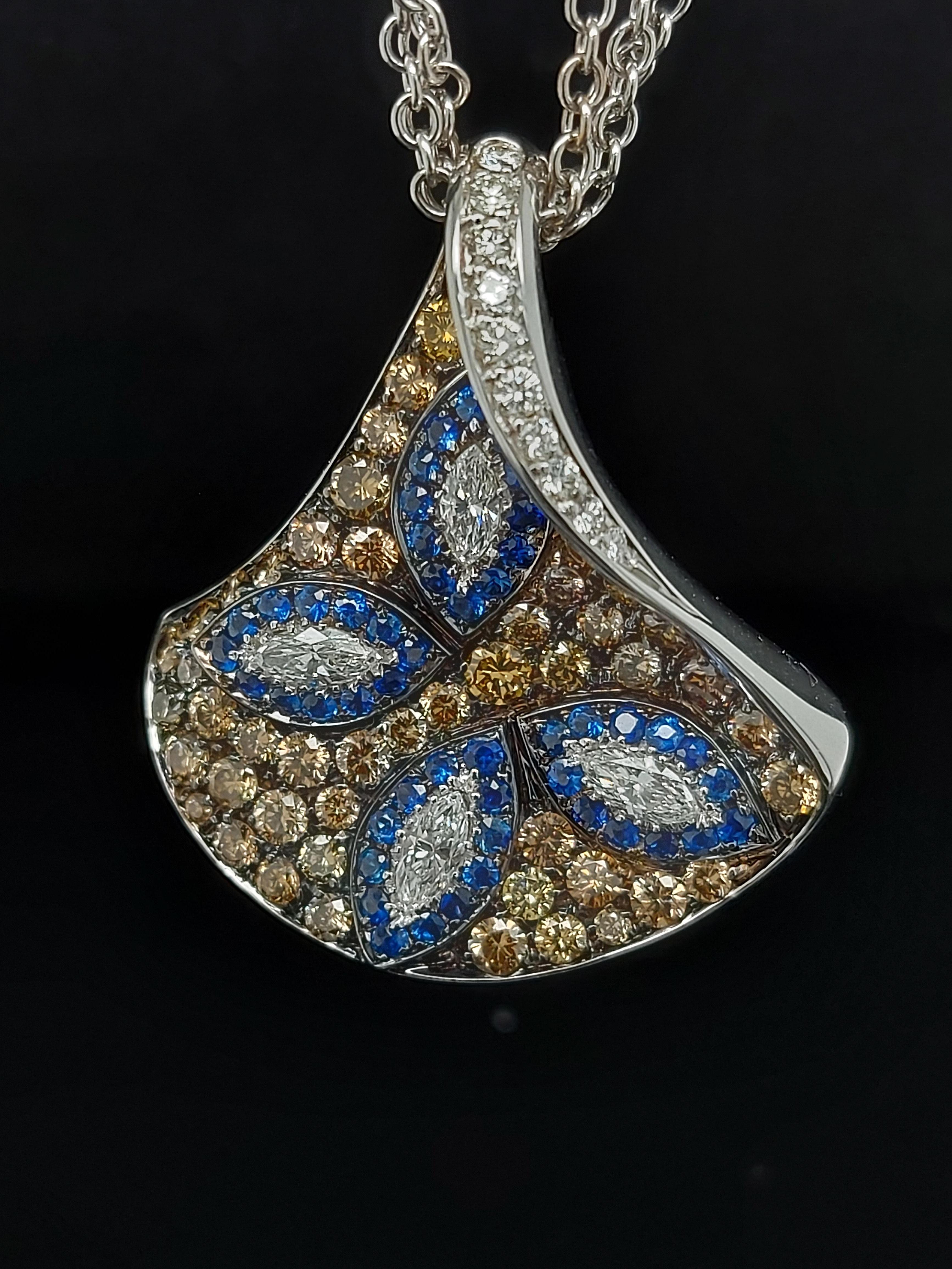 18kt White Gold  White & Brown Diamonds & Sapphire Triangle Pendant Necklace 

Amazing hand crafted necklace. Can be purchased with a matching ring.

Diamonds: Brown and white brilliant and marquise cut diamonds together 3.24 carat

Sapphires: 48