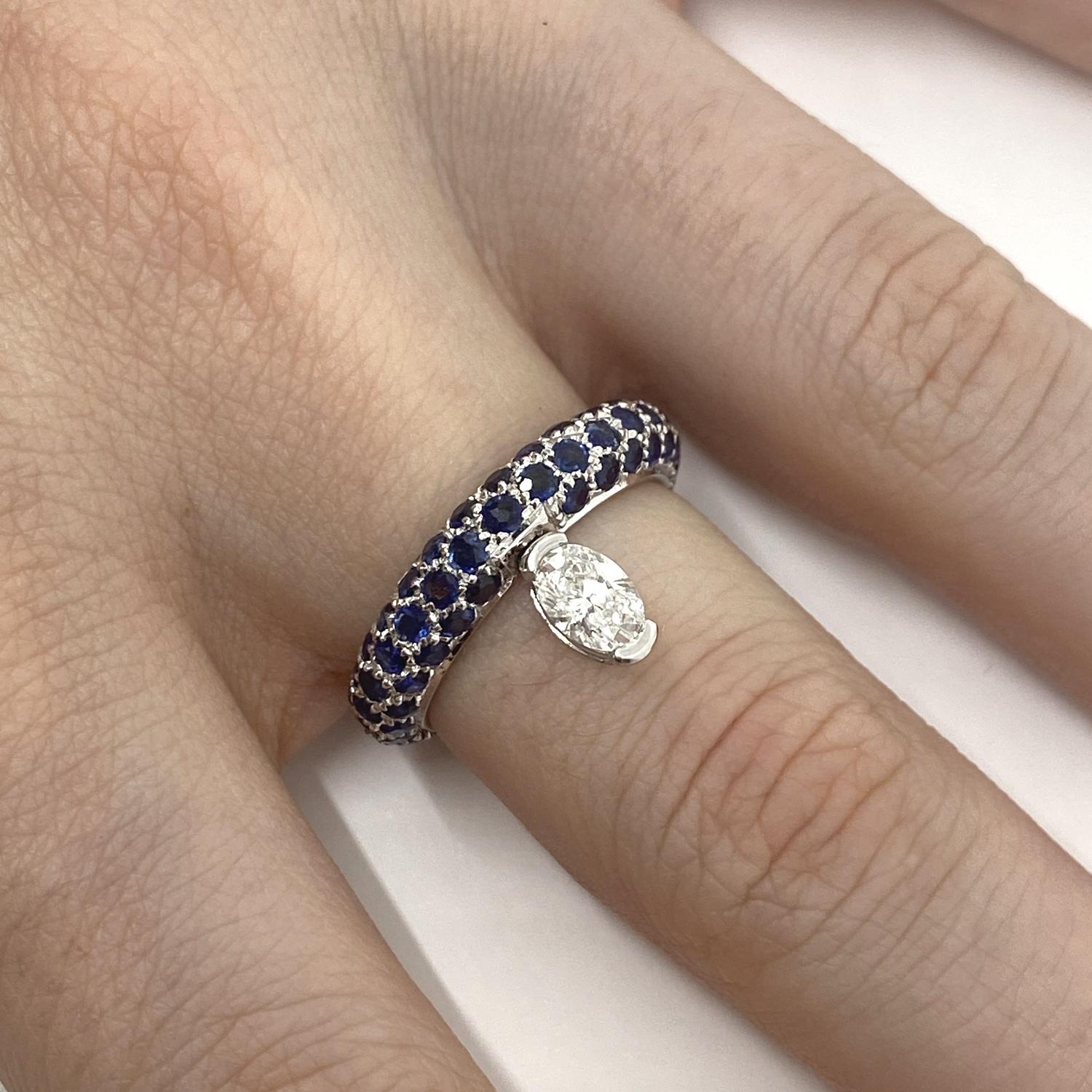 Ring made of 18kt white gold paved with brilliant-cut blue sapphires for ct.2.80 and oval-cut natural diamond for ct.0.43

Welcome to our jewelry collection, where every piece tells a story of timeless elegance and unparalleled craftsmanship. As a
