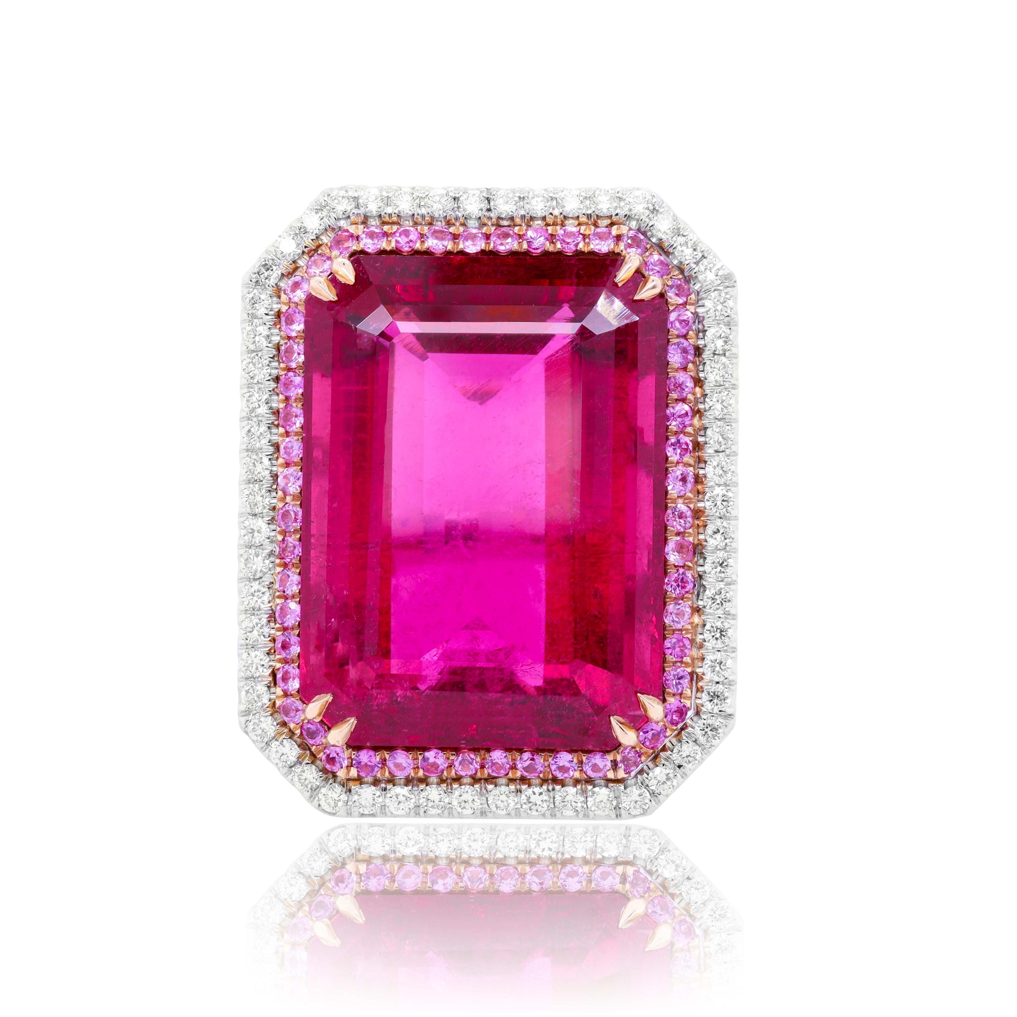 18kt White Gold Pink Tourmaline Diamond Ring With 25.93ct Of Pink Tourmaline Set In Double Halo Setting With .60ct Of Pink Sapphires And 1.00ct Of Micropave Diamonds.
