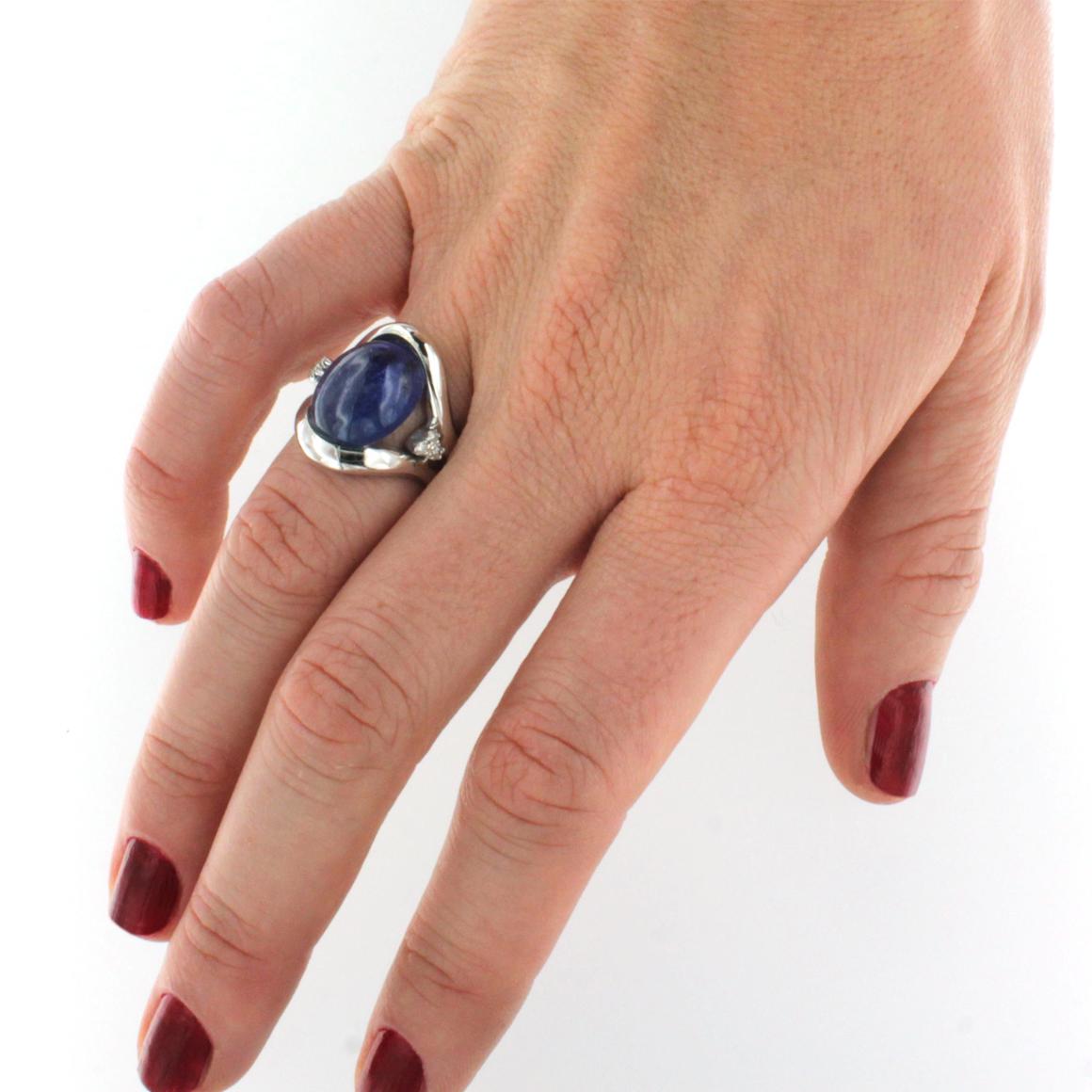 Timeless elegance for this amazing ring in 18k white gold handemade in Italy by Stanoppi Jewellery since 1948. Tanzanite (oval cabochon cut, size: 12x15 mm cts 11.05) and white Diamonds cts0.06 VS colour G/H. 

Size of ring: 13 EU  - 7,5 USA  
