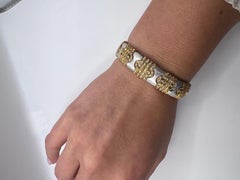 18kt white gold, yellow gold, and diamond bangle bracelet