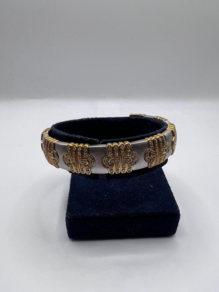 Round Cut 18kt white gold, yellow gold, and diamond bangle bracelet For Sale
