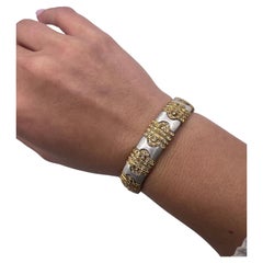 18kt white gold, yellow gold, and diamond bangle bracelet