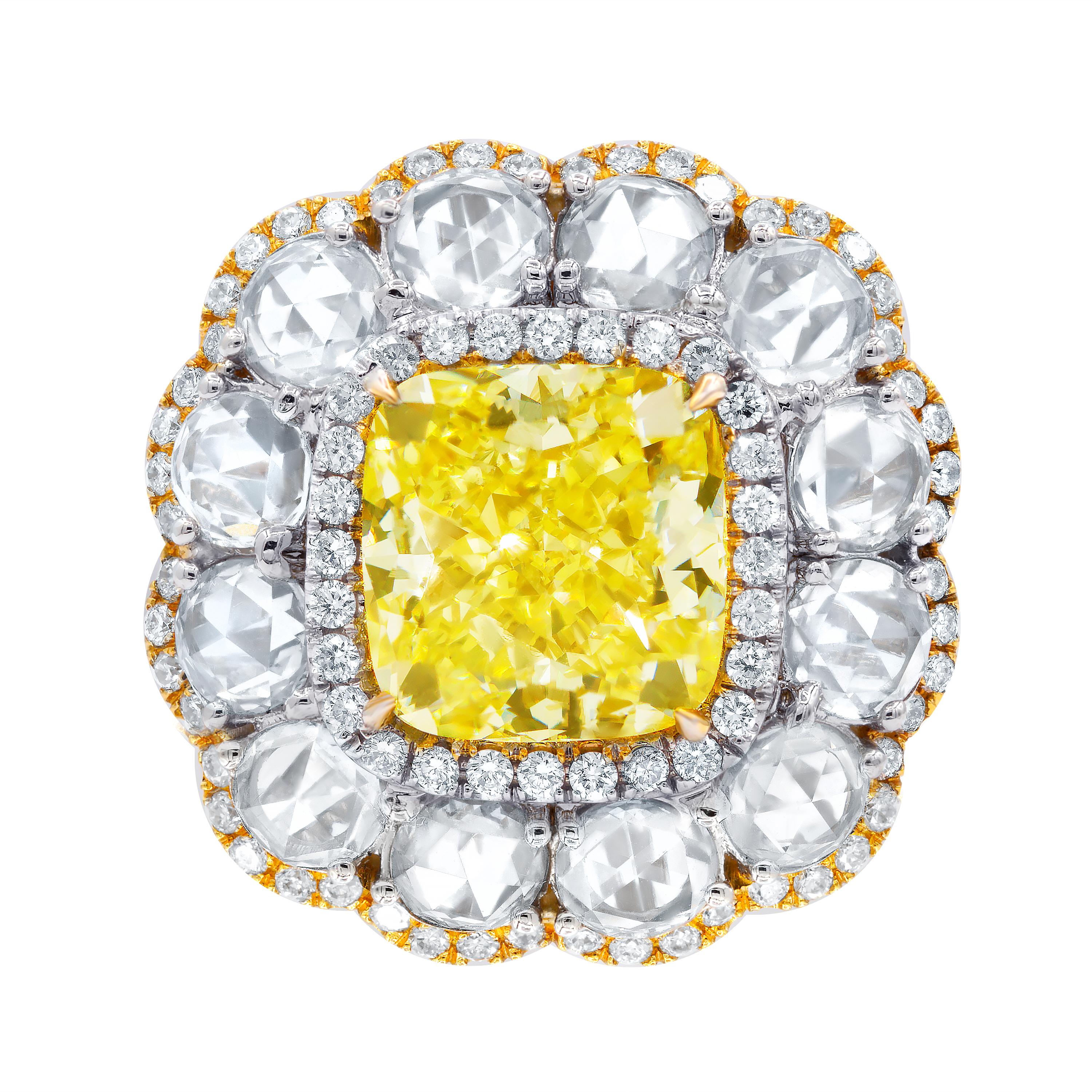18kt yellow and white gold diamond ring, features GIA certified 6.16 ct fancy yellow color and vs2 clarity cushion  cut diamond (radc890) set with 2.88 carats of rose cut diamonds.

