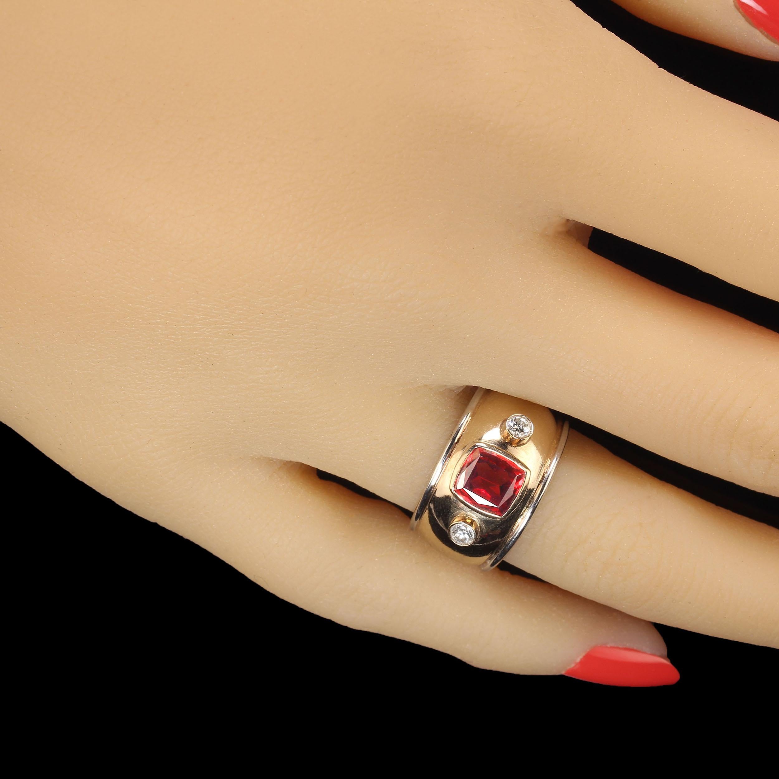 
Stunning 18KT Yellow and White Gold Wide Band Ring with Garnet and Diamonds
Elevate your jewelry collection with this exquisite 18KT yellow and white gold wide band ring, featuring a striking bezel-set garnet and dazzling diamonds. This beautifully