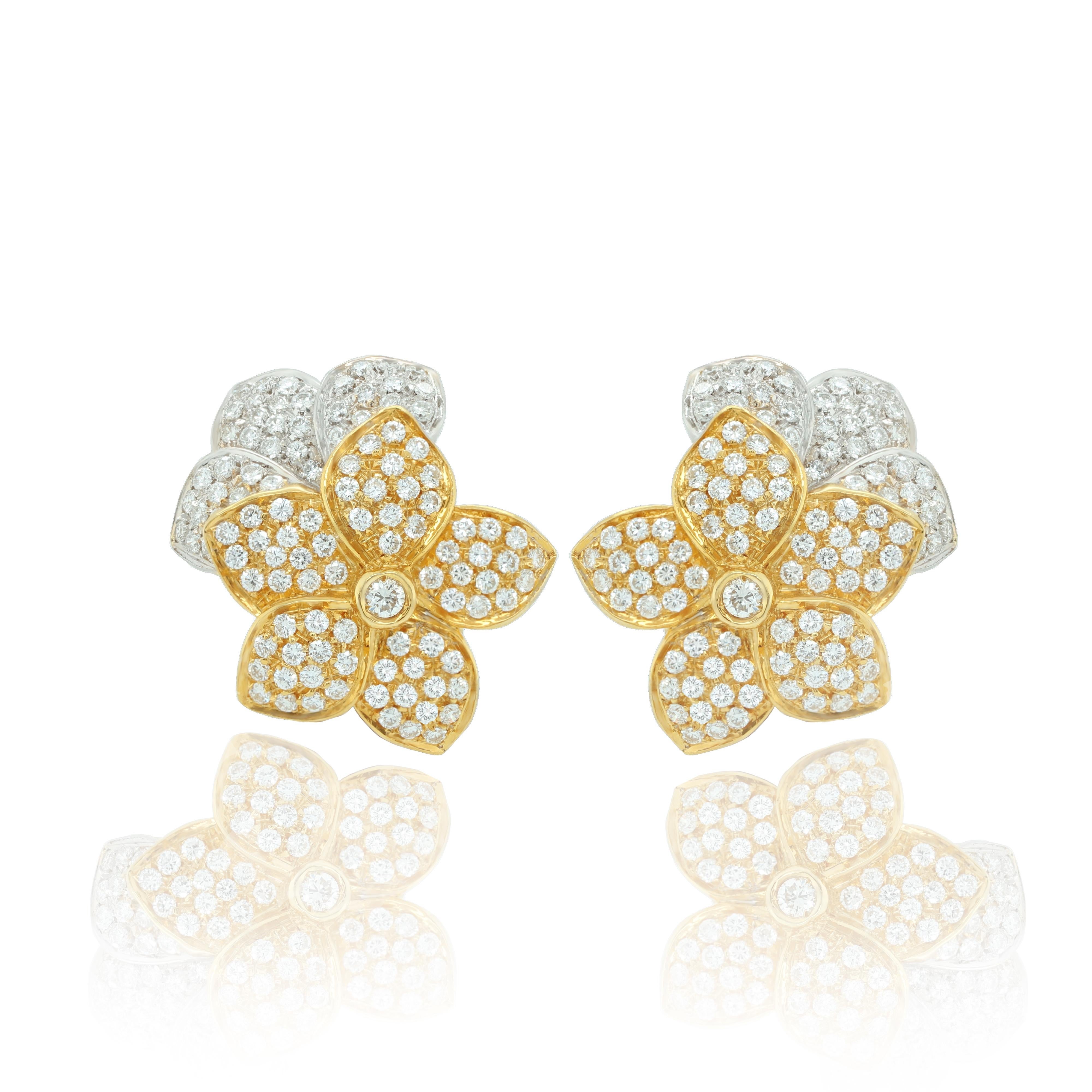18kt yellow and white gold flower shaped diamond earrings feature 3.00cts.
