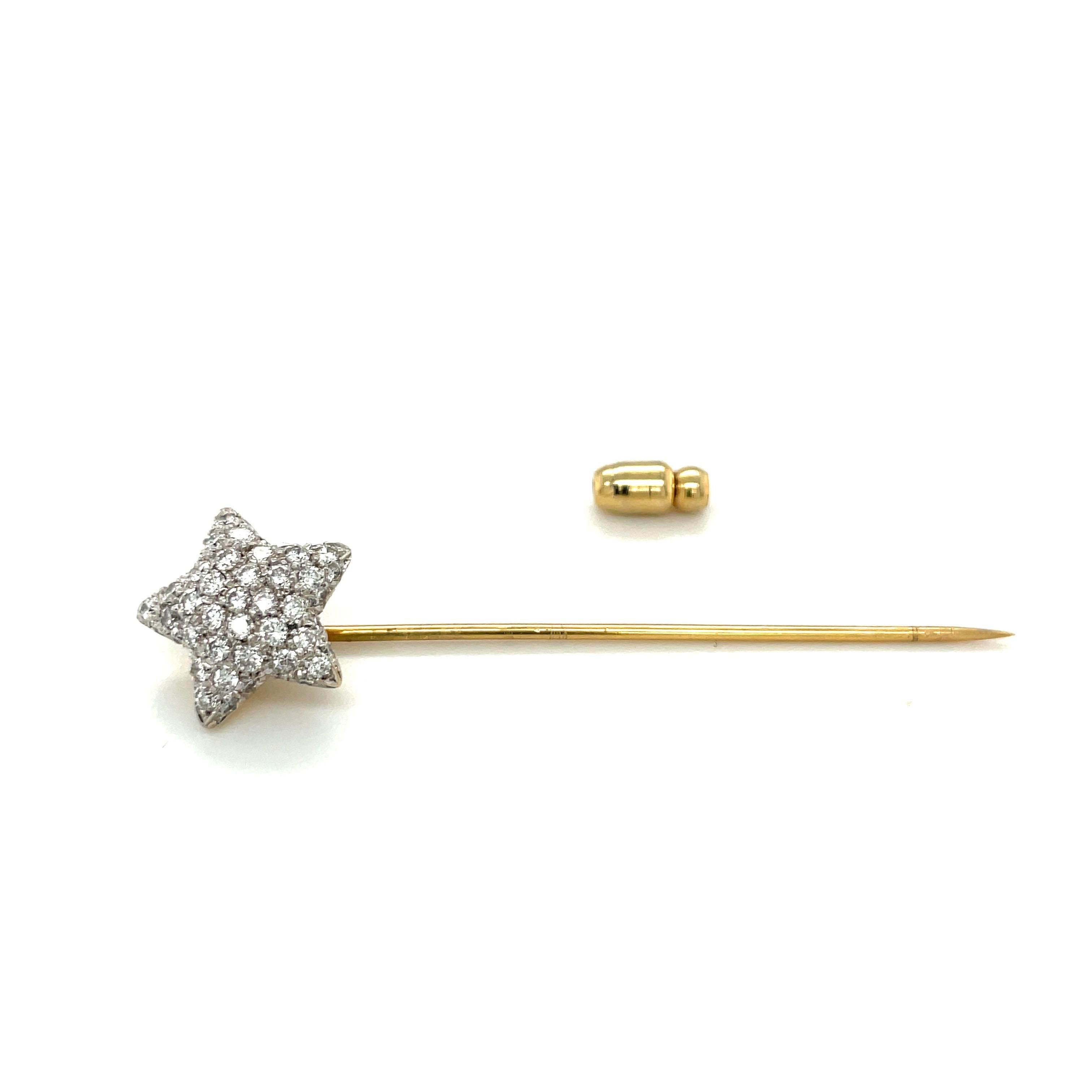 Some things will always remain classic, and this is one of them.
The 18 karat yellow gold stick pin is designed with a  pave' diamond five pointed star.
Total diamond weight = 0.93 carats
Total length = 2.25