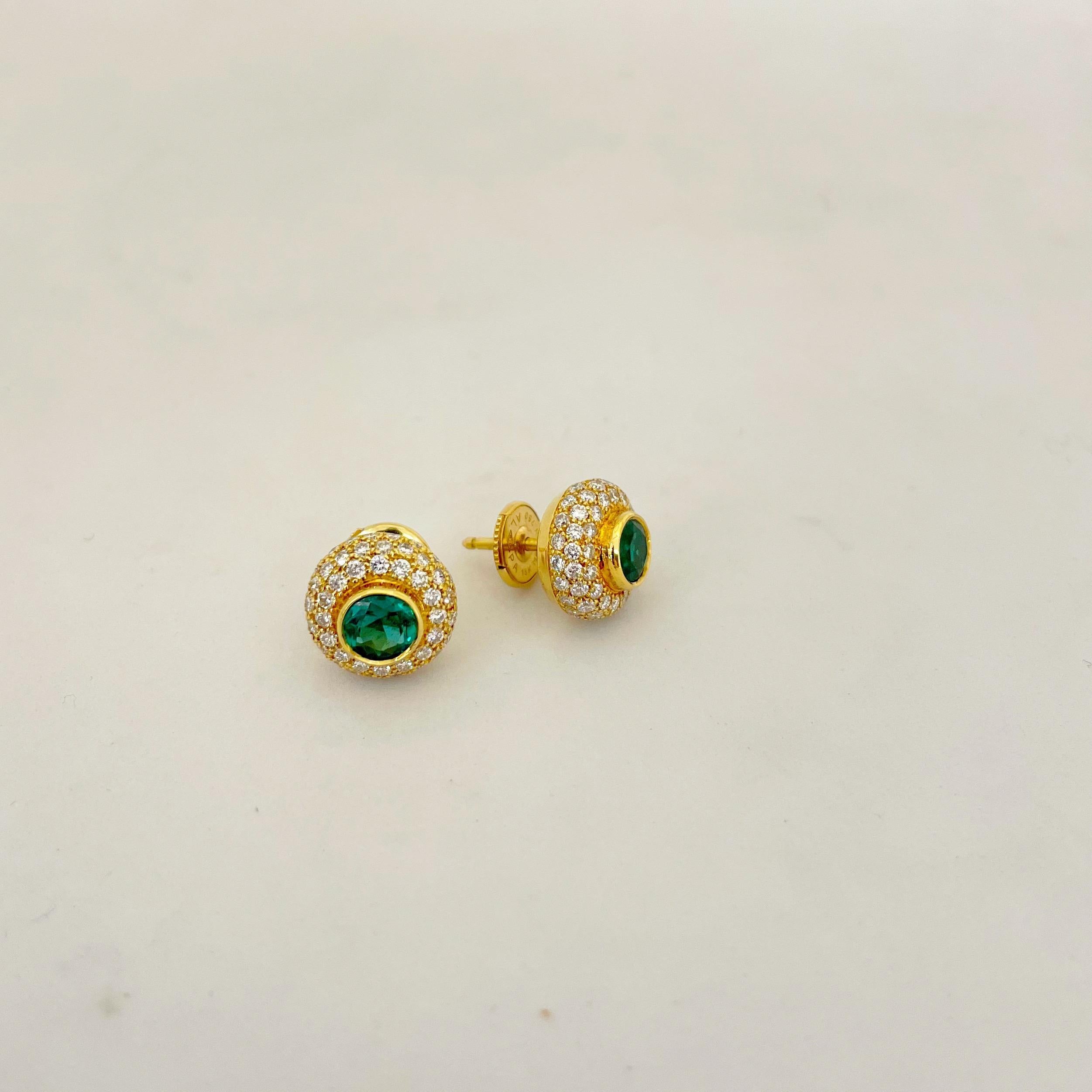 These beautiful studs feature 0.98cts of round green emeralds bezel set in 18kt yellow gold among 1.37cts of white round brilliant pave diamonds. 
These unique studs are easy to wear both day and night, casual or dressy.
Signed Linderman